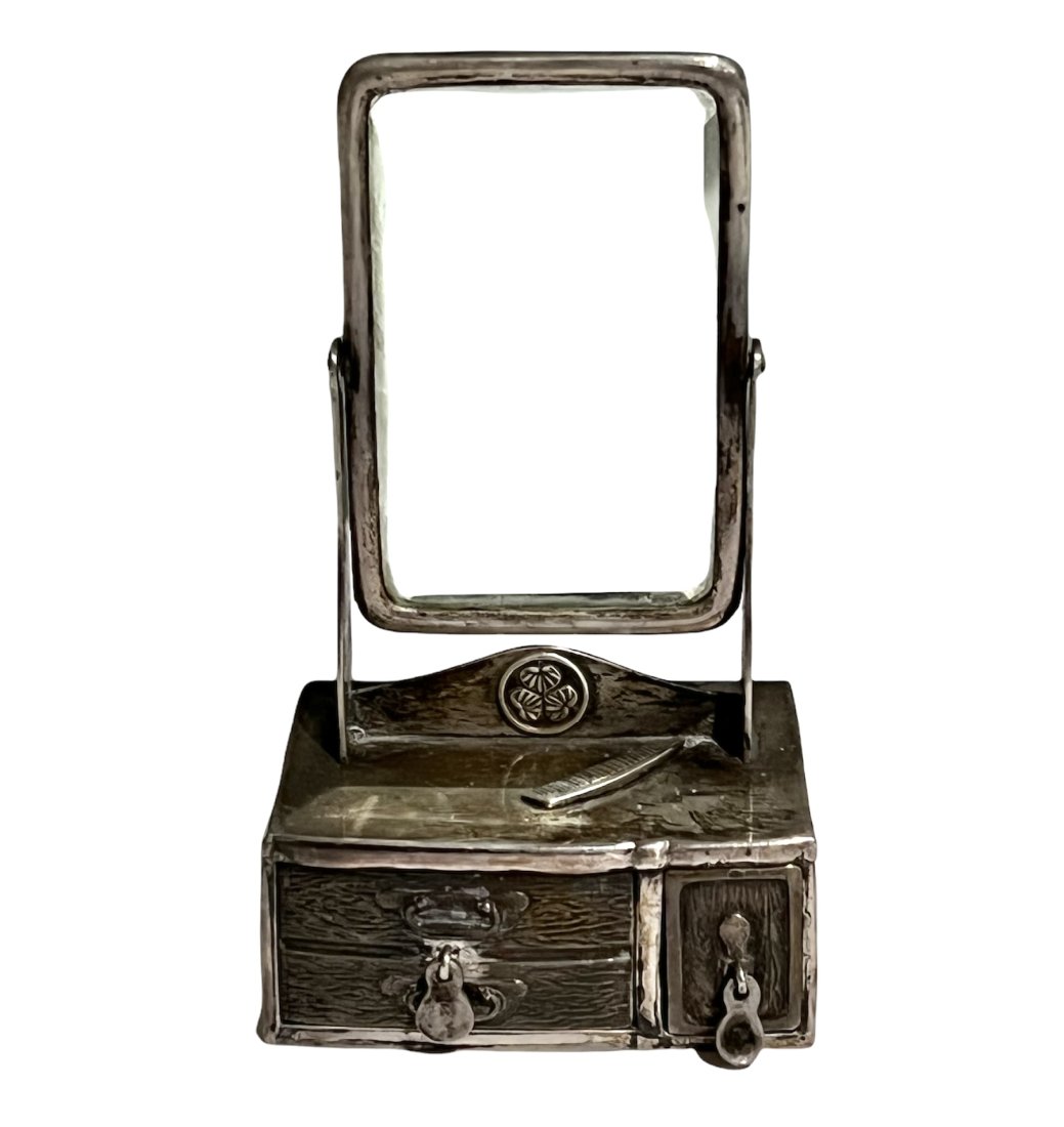 Sterling Silver Miniature Dresser with Bevelled Mirror: Sterling silver miniature dresser with working drawers and swivel bevelled mirror. Marked sterling on the bottom. It measures 3 inches tall by 1.75 inches wide by 1 inch deep. It weighs 73.5 grams tot
