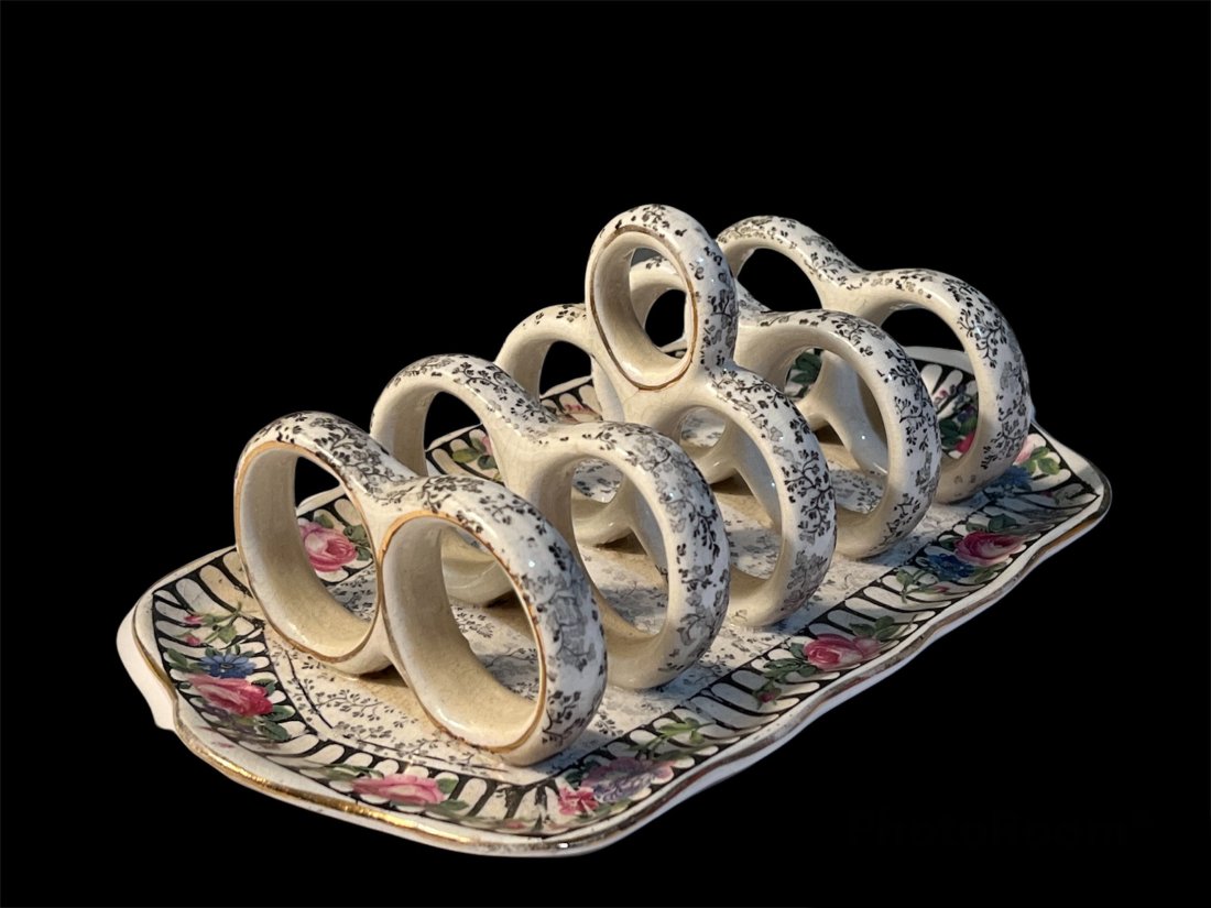Royal Winton Chintz Toast Rack Server: Royal Winton Chintz Toast Rack Server. It measures 8.5 long by 3 inches tall by 4.5 inches deep.