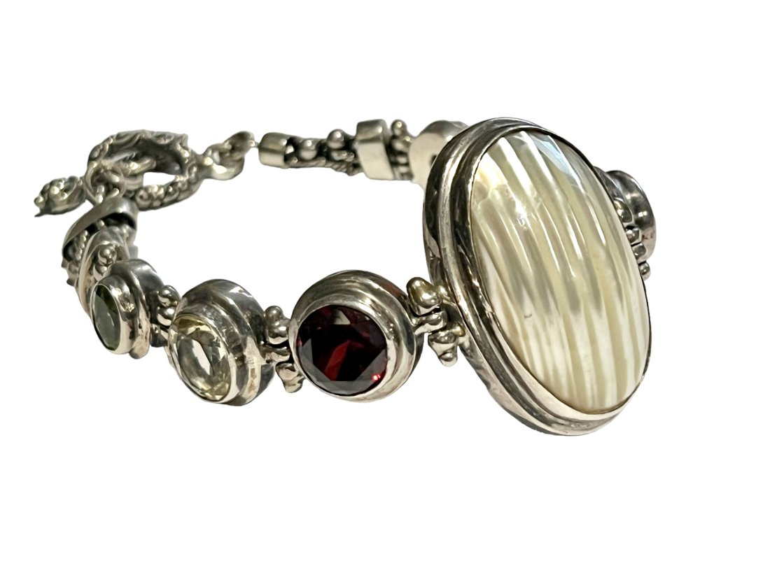 Sterling Silver Bracelet with Garnets, Peridot, Citrine and MOP: Sterling Silver Bracelet with Garnets, Peridot, Citrine and MOP. It measures 7.5 inches.