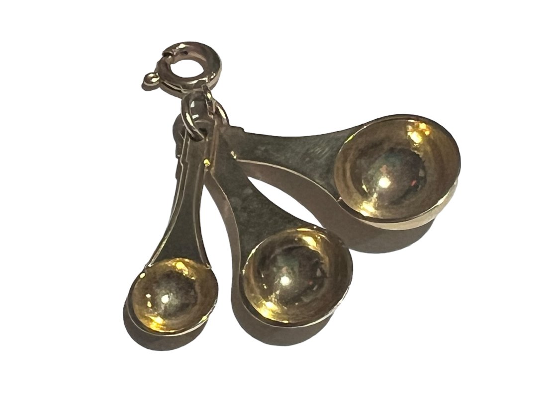 14K Gold Measuring Spoons Charm: 14K Gold Measuring Spoons Charm. It weighs 3.1g/2dwt. It measures 1 inch long.