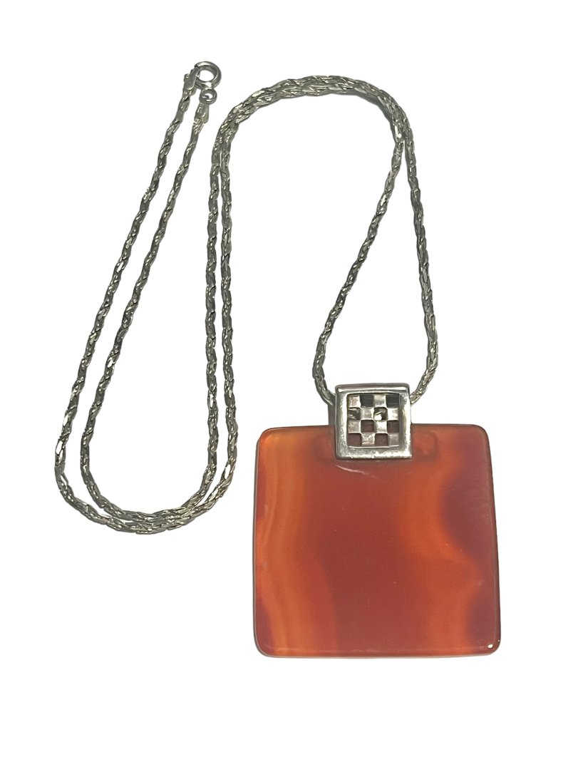 Vintage Sterling Silver and Carnelian Pendant on Sterling Chain: Vintage Sterling Silver and Carnelian Pendant on Sterling Chain. The pendant measures 1.5 inches by 2 inches. The chain is 24 inches.