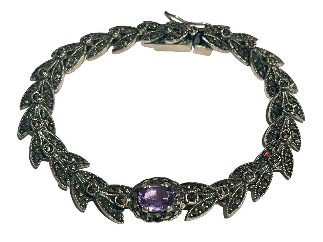Sterling Silver Amethyst and Marcasite Bracelet: Sterling Silver Amethyst and Marcasite Bracelet. It measures 7 inches long.