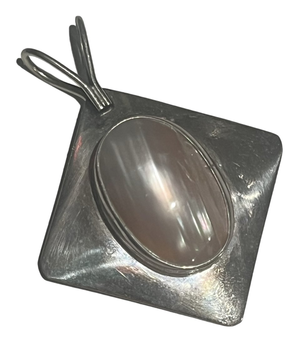 Nakai Navajo Native American Sterling Silver Pendant with Mother of Pearl: Nakai Navajo Native American Sterling Silver Pendant with Mother of Pearl. It measures 2.25 inches long.