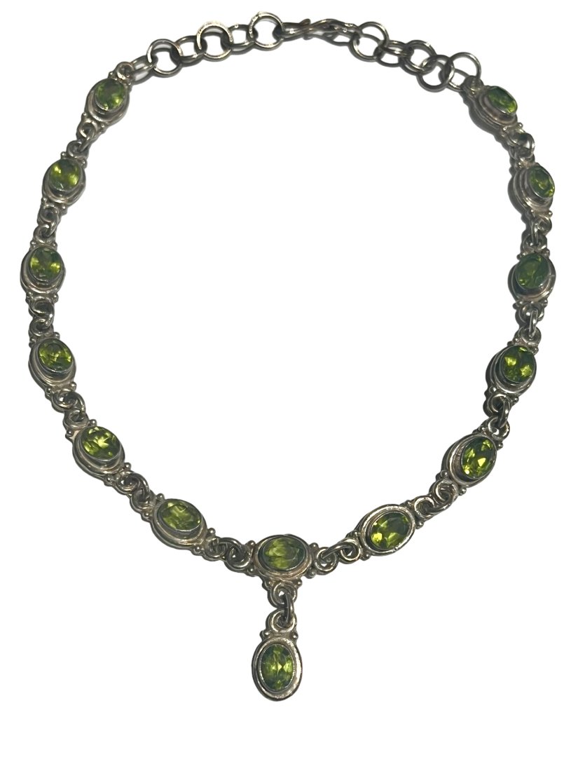 Vintage Sterling Silver and Peridot Choker Necklace: Vintage Sterling Silver and Peridot Choker Necklace. It measures 14.25 Inches long. Shipping- In addition to LiveShip, Live Auctioneers Shipping), we also offer flat rate Priority shipping through the