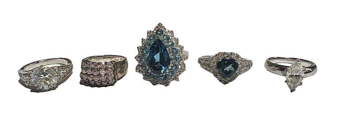 Lot of 4 Sterling Silver Rings with Sparkly Stones: Lot of 4 Sterling Silver Rings with Sparkly Stones Various sizes see pics. Shipping- In addition to LiveShip, Live Auctioneers Shipping), we also offer flat rate Priority shipping through the USPS and
