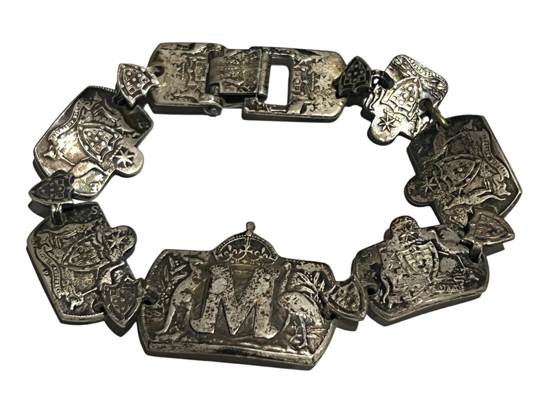Unique Custom Made WW2 Era Australian Coin Bracelet: Unique Custom Made WW2 Era Australian Coin Bracelet. Shipping- In addition to LiveShip, (Live Auctioneers Shipping), we also offer flat rate Priority shipping through the USPS. We will combine shippin