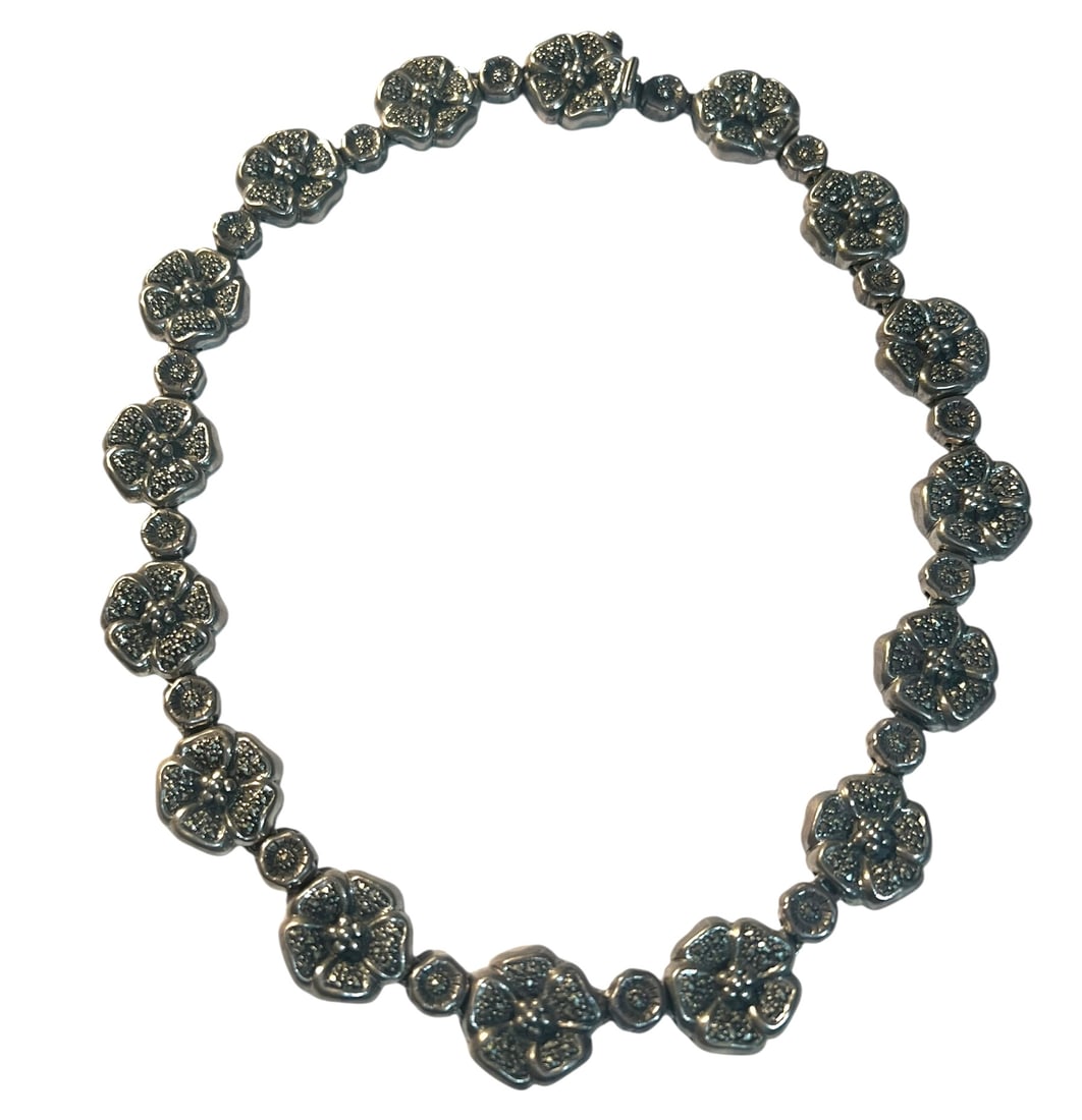 Sterling Silver Marcasite Flower Necklace: Sterling Silver Marcasite Flower Necklace. It is 16 inches long.