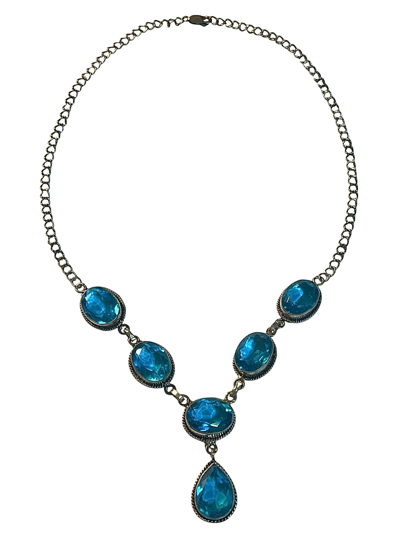 Sterling Silver and Blue Topaz Necklace: Sterling Silver and Blue Topaz Necklace. It is 18 inches long.