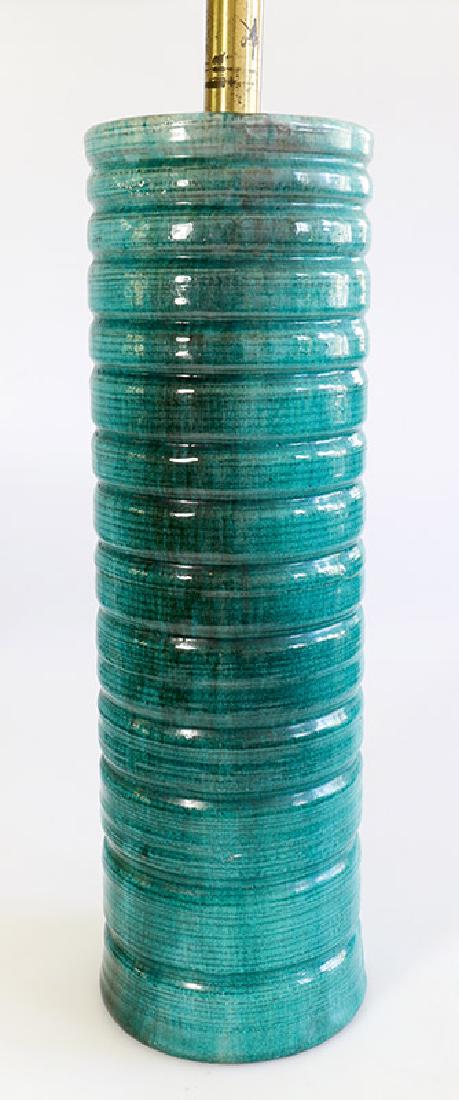 Lamp base Otto Douglas-Hill: Ceramics. Greenish turquoise glaze with craquelÃ©. Horizontal groove decor. High cylindrical shape. Small opening at the top centrally and at the bottom for cable passage and mount. H. 78 cm (with m
