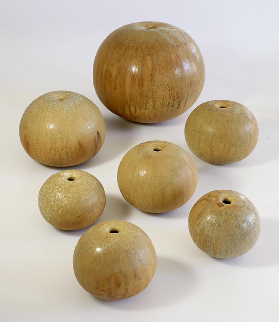 Gotlind Weigel, 7 ball vases: Ceramics. Porcelain stoneware. Multi-tone beige-ocher, partially light gray structured glaze. H. 8-19.5 cm. All vases on the ground marked with workshop mark (stamp).
