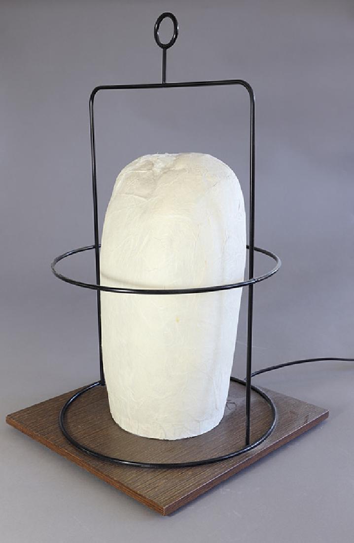 Table lamp WL 01 D Andrea Branzi: Black metal wire, wood, rice paper. 50 x 30 x 30 cm. Design Gallery Milano, Design 1995/96, Literature: Fiell, Charlotte & Peter, 1000 lights. 1960 to present. KÃ¶ln 2005, Vol. II, Abb. S. 430 und F