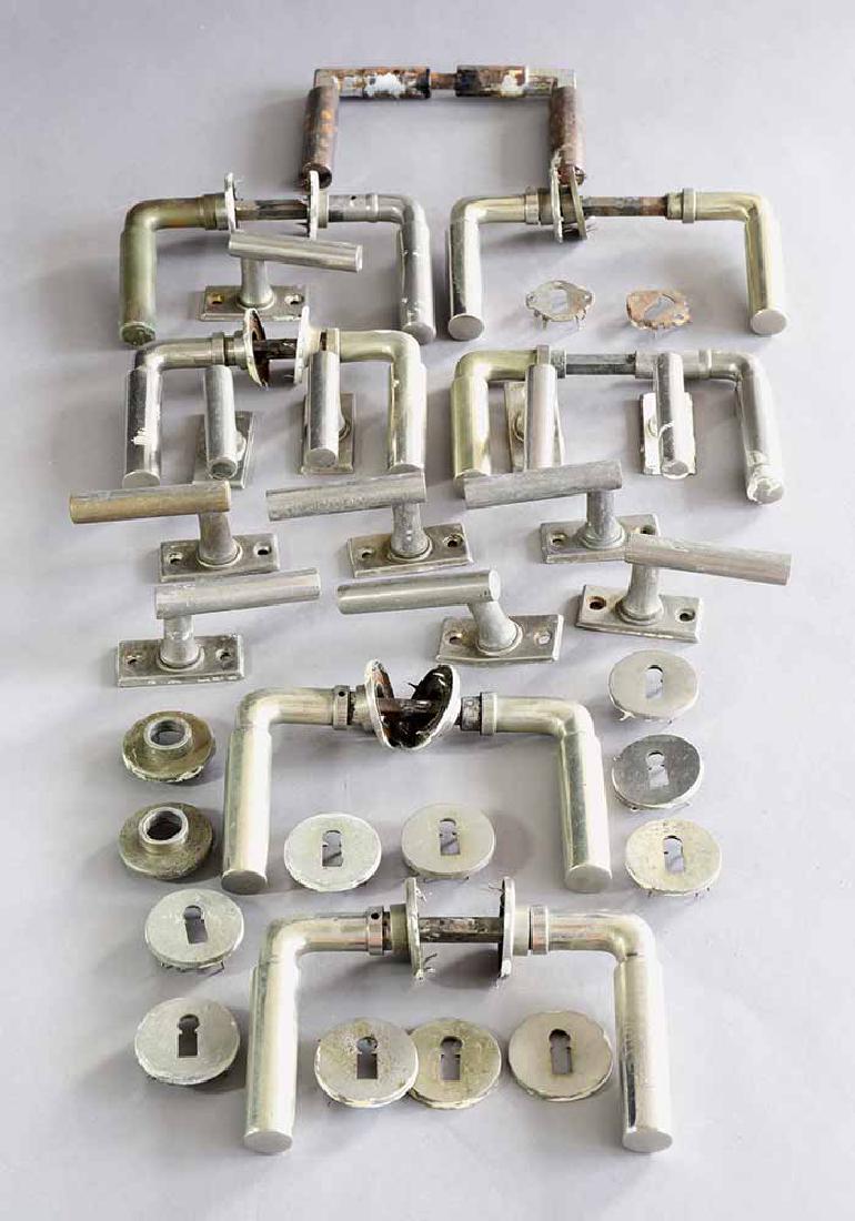 Walter Gropius, Wehag, 7 p. of Door + 11 Window Handles: 7 pairs of door handle sets and 11 window handles. Designed 1932. 5 Door handle sets by Wehag in nickel-plated brass with round veneers for the keyhole. 1 set of iron, partially repainted and 1 of nic