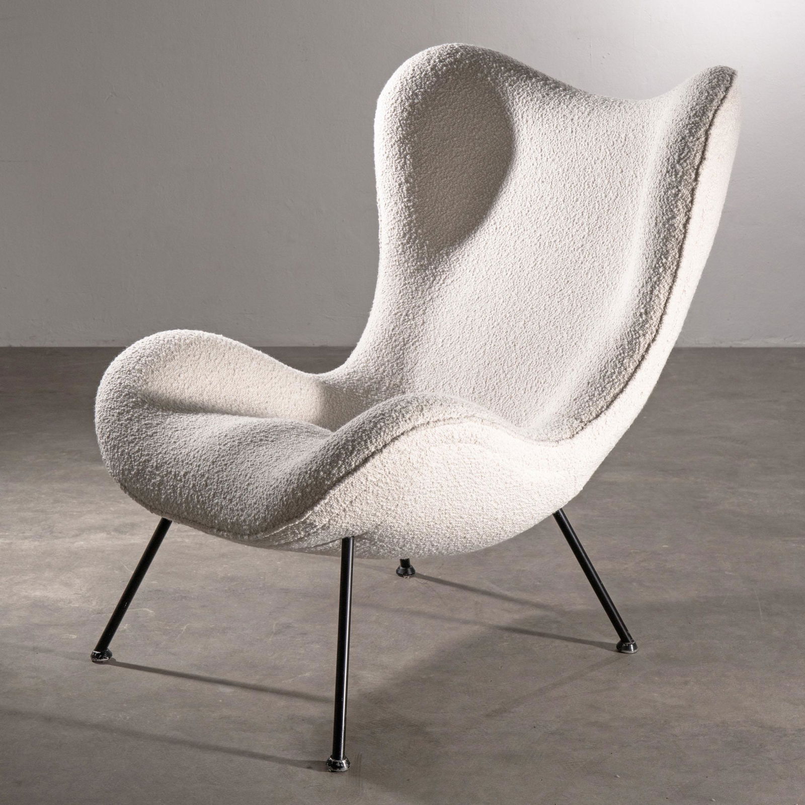 Fritz Neth, Neth Sitzformbau / Correcta, Lounge Chair Model Madame: Fritz Neth Neth Sitzformbau / Correcta Lounge chair, model Madame. Design 1950s. Seat shell with metal frame, natural white fabric, black lacquered tubular steel. 93 x 75 x 98 cm. Literature: R. Bermp