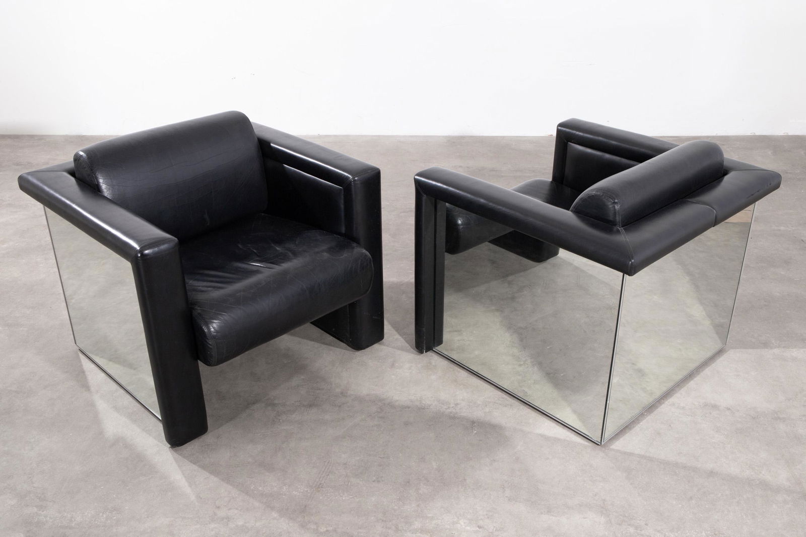 Trix & Robert Haussmann, Knoll International, 2 Mirror Armchairs Model 57S1: Trix & Robert Haussmann Knoll International 2 armchairs model 57S1. Designed 1988. Black leather, mirror glass. 74 x 81 x 86. Inscribed 'Knoll' on the underside. Literature: Knoll International, Produ
