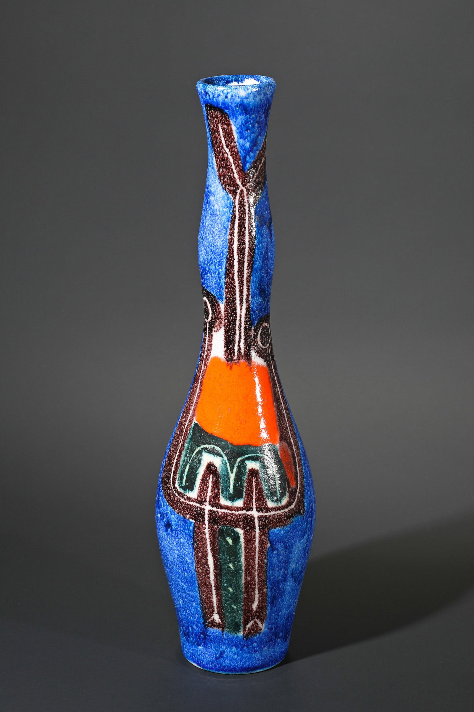 Guido Gambone, Vase: Guido Gambone Vase. Ceramics. Stylized figural painting in brown, orange, green on a blue background. Glaze with craquelure. H. 39.5 cm. Inscribed on the bottom: Donkey brand with the addition GAMBONE