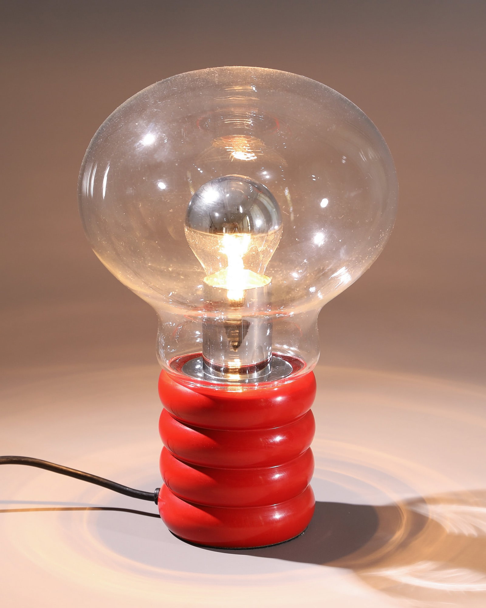 Ingo Maurer, Design M, Table Lamp, model Bulb: Ingo Maurer Design M Table lamp, model Bulb. Designed in 1966. Clear glass, red painted metal. H. 29 cm, D. 19 cm. Literature: Helmut Bauer, Ingo Maurer: Making Light, München 1992, Abb. S. 26 ff