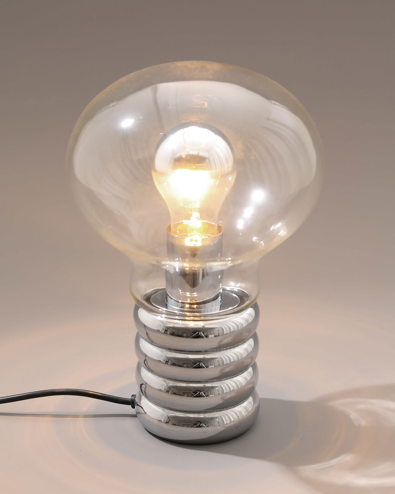 Ingo Maurer, Design M, Table Lamp, model Bulb: Ingo Maurer Design M Table lamp, model Bulb. Designed in 1966. Clear glass, chrome-plated metal. H. 29 cm, D. 19 cm. Literature: Helmut Bauer, Ingo Maurer: Making Light, München 1992, Abb. S. 26