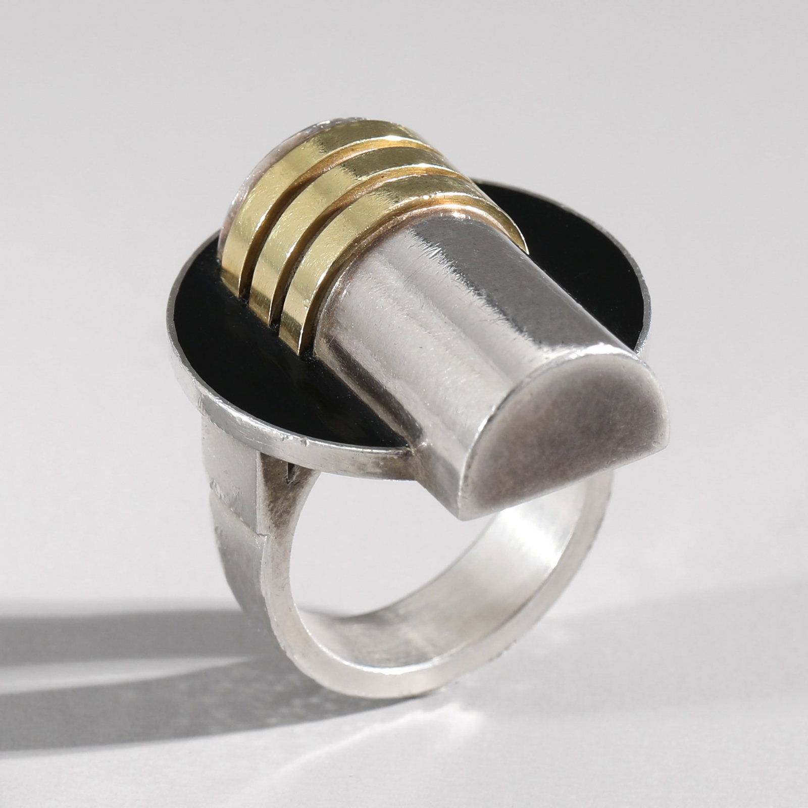 Jean Després. Ring: Jean Després Ring. Around 1930. Silver, yellow gold and black enamel. 30 x 24 mm. Weight 15.9g.