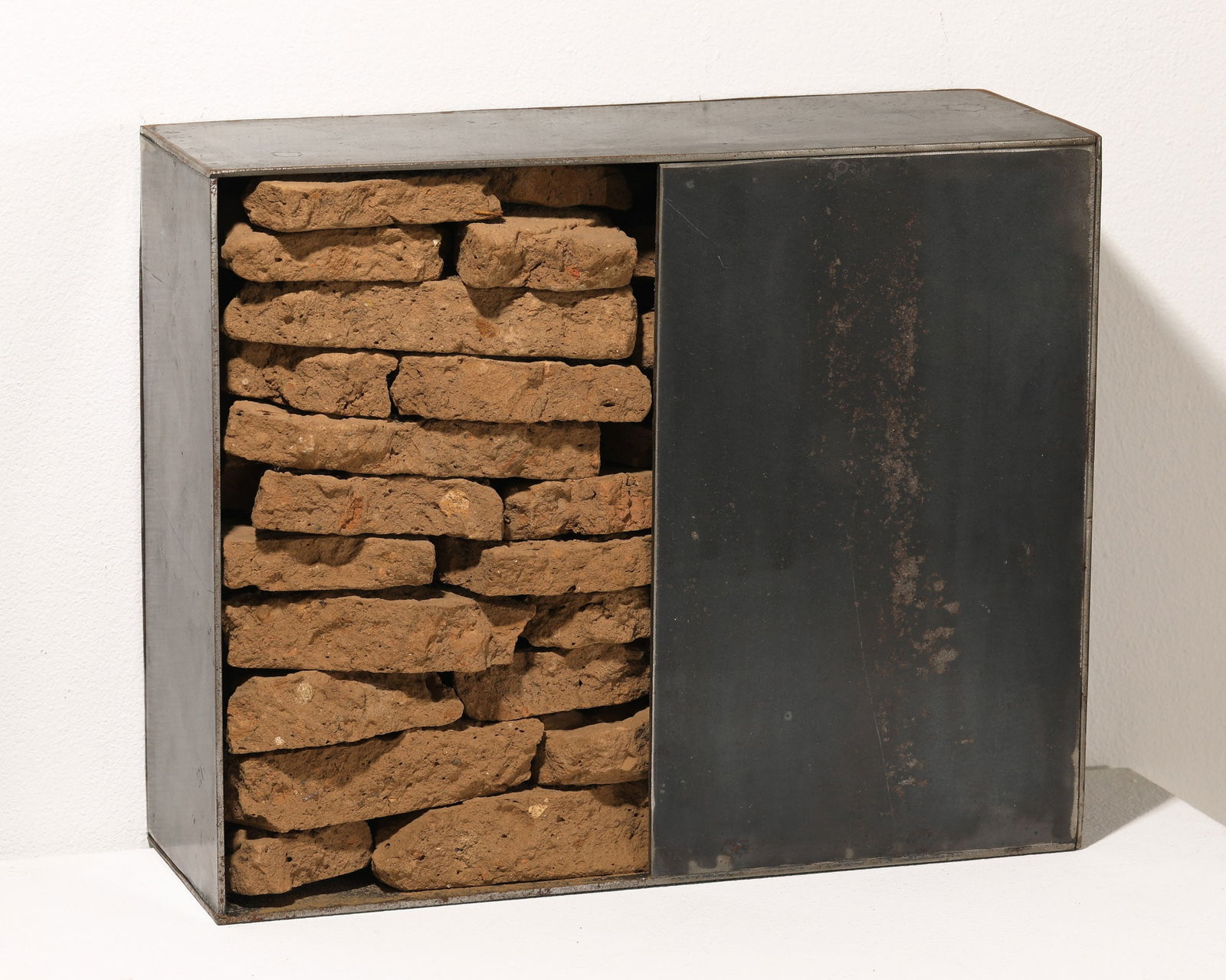 Madeleine Dietz, Wall Object, 1999: Madeleine Dietz, (*1953) Untitled. 1999. Dried soil stacked in steel body. 29 x 35.3 x 13 cm. Monogrammed and dated verso lower left: M.D. 99 (impact stamp).