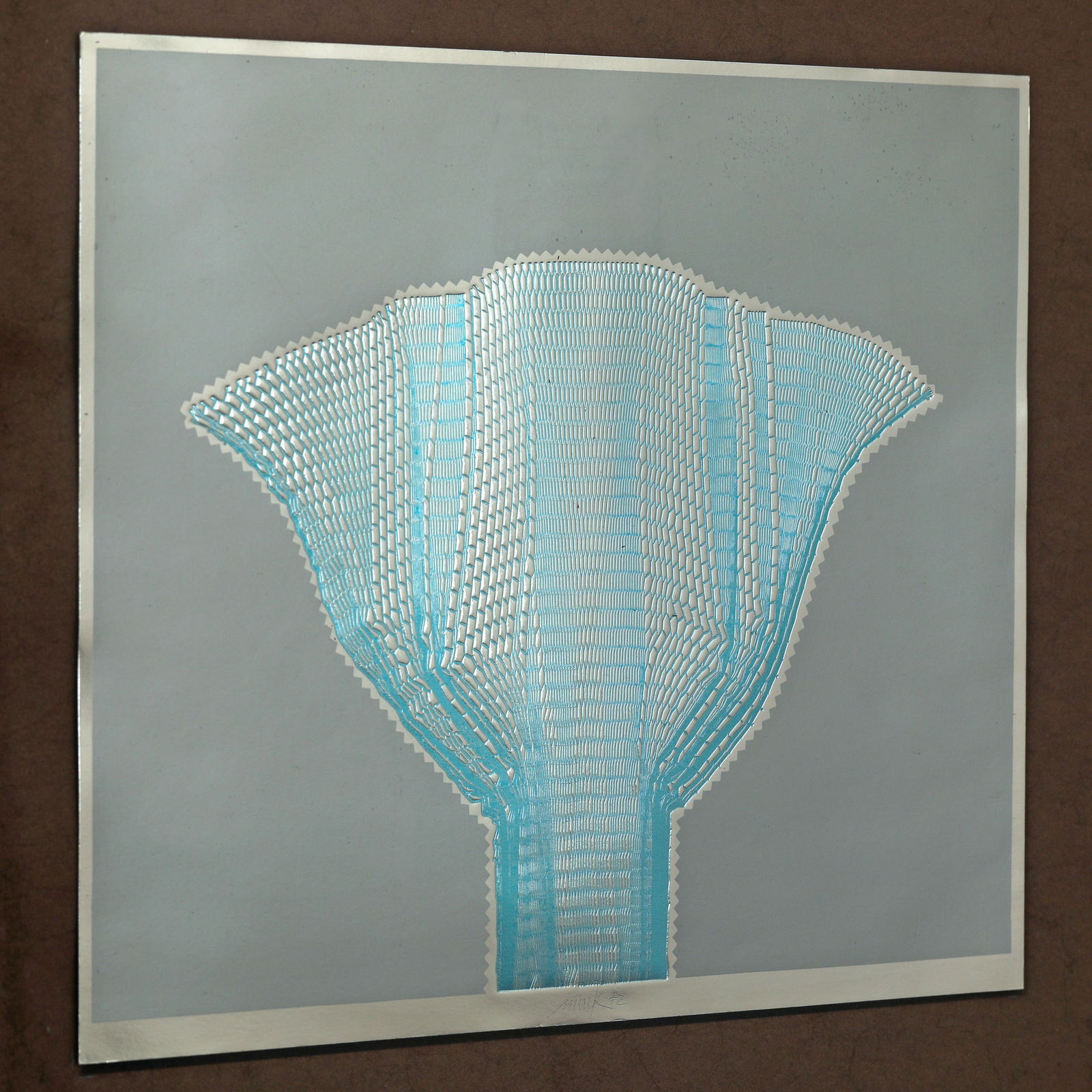 Heinz Mack*, Multiple Hundertblatt IV, 1972, signed: Heinz Mack*, (*1931) Hundertblatt IV. 1968/72. Color silkscreen and embossed print on aluminum foil cardboard. 38 x 32.7 cm. Signed and dated lower center: Mack72. Framed behind glass and described as