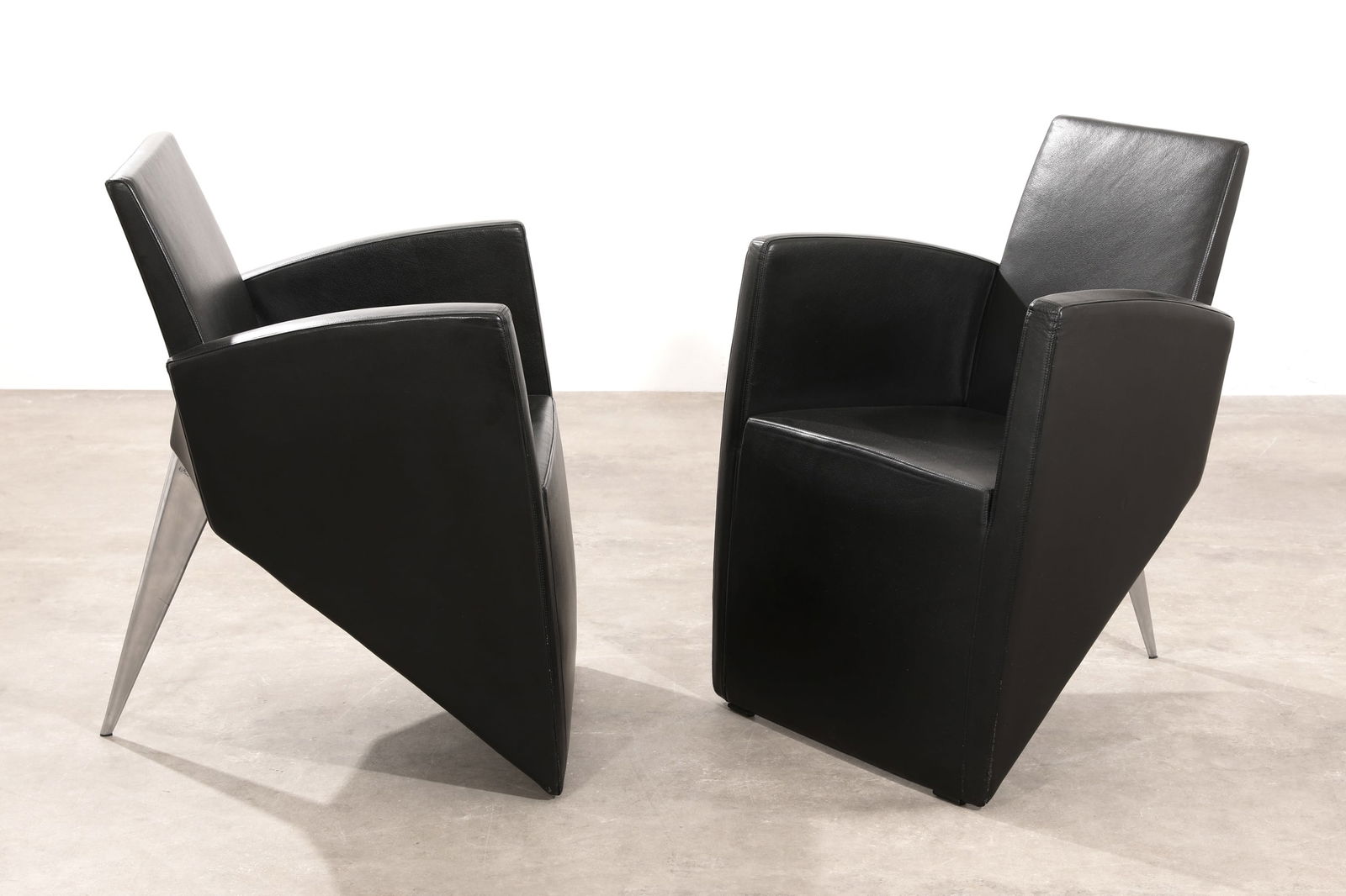 Philippe Starck, Aleph, 2 Chairs, model J. Lang: Philippe Starck Aleph 2 chairs, model J. Lang. Designed in 1987. Polished aluminum, black leather. 85 x 62 x 61 cm. Inscribed at the top of the leg. Literature: Volker Albus & Volker Fischer, 13 nach