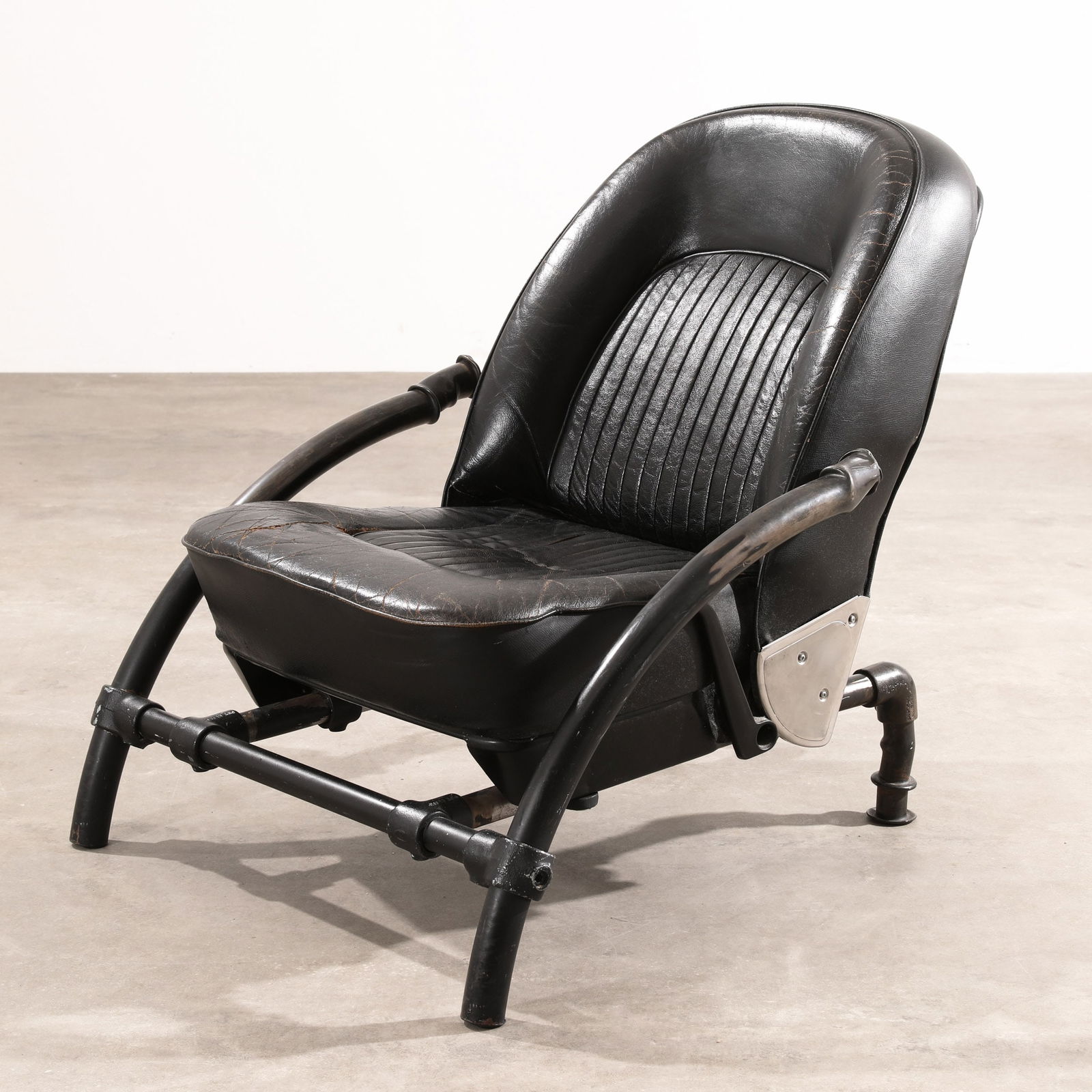Ron Arad, One Off, signed Prototype / early development stage of Rover Chair: Ron Arad One Off Prototype / early development stage of the Rover model armchair. Designed in 1981. Painted tubular steel, Rover seat in black leather and imitation leather. 81 x 72 x 76 cm. On the le