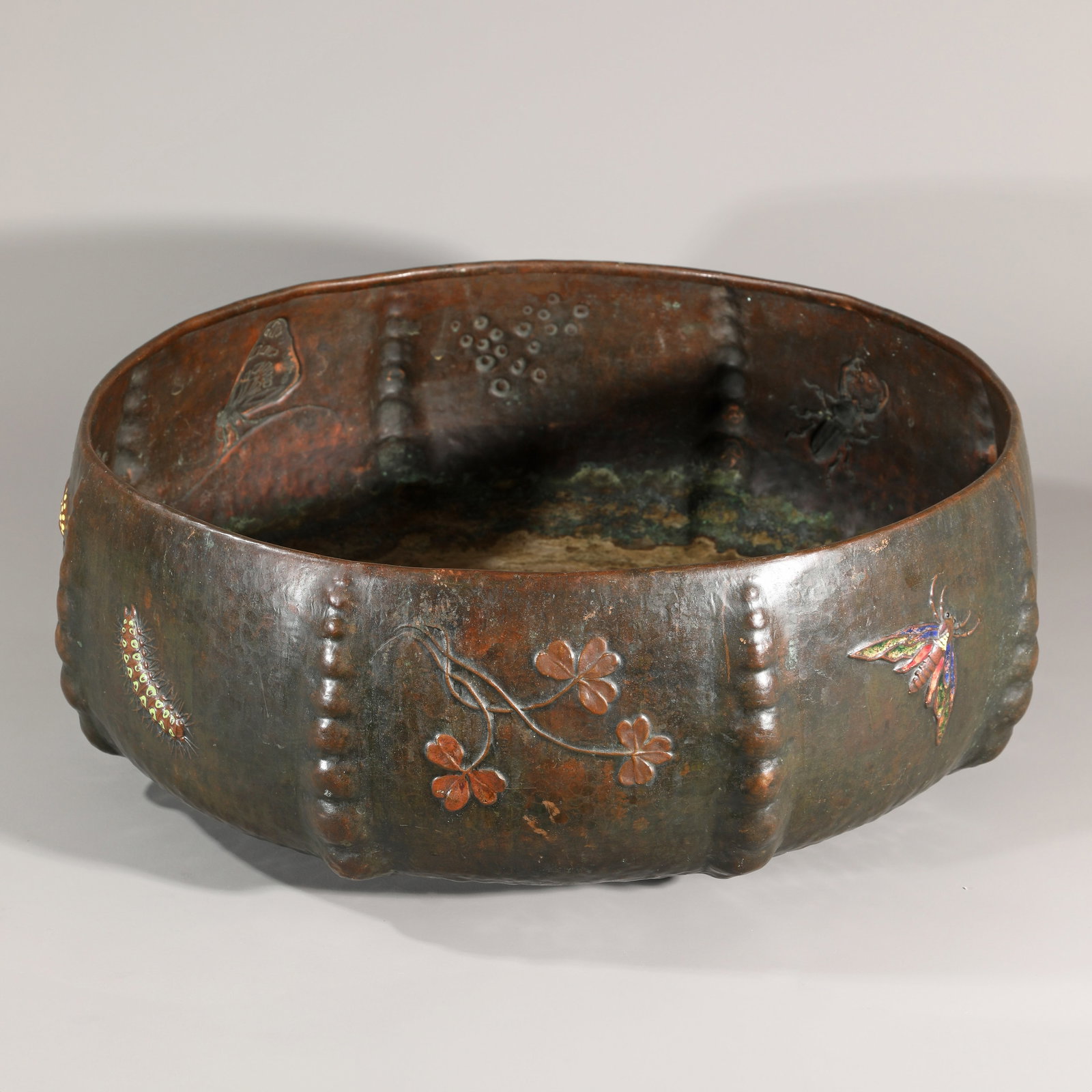 Ludwig Vierthaler, Plant bowl: Round metal bowl with partially colored motifs of flora and fauna. Design: Winhart & Co. H 18 cm, D 50 cm. Marked on the underside: # 924, manufacturer's mark.