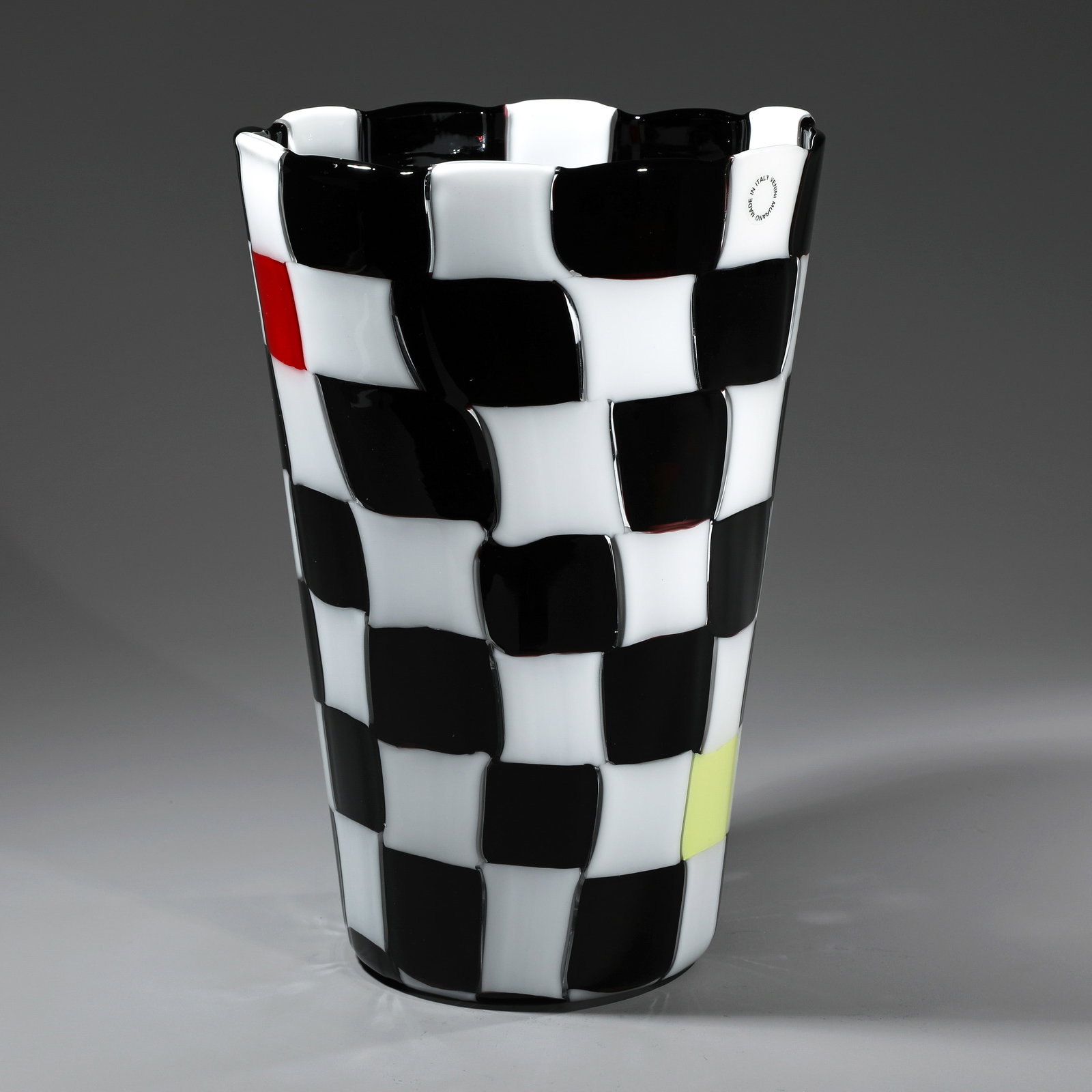 Gianni Versace, Vase VVV: Versace Designed around 1995. Made by Venini & C., Murano. Murrine in deep violet and white, white with red and white with yellow, fused together in a checkerboard pattern. H. 25.7 cm. Marked on the b