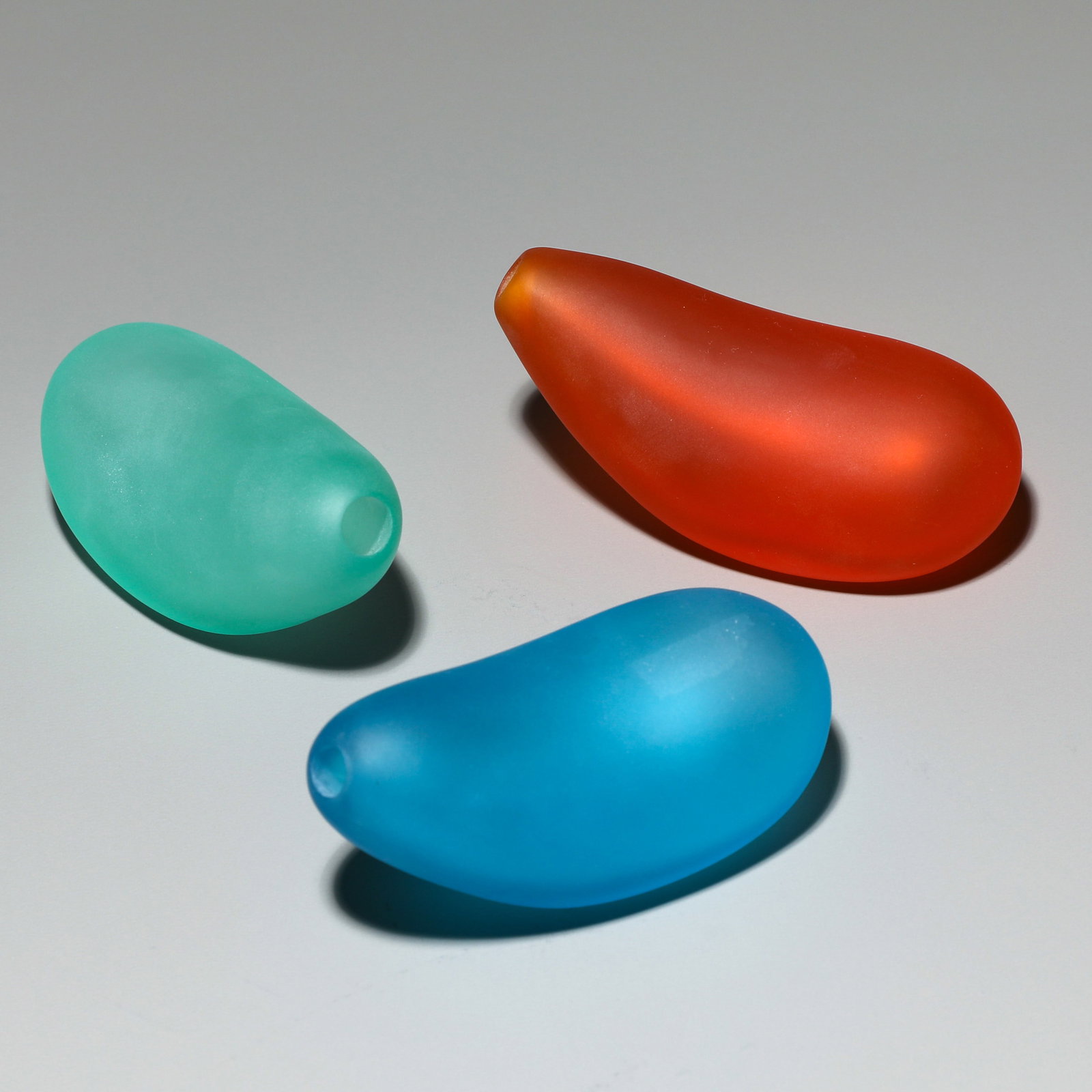 Philippe Starck, 3 Miniature Vase model L' Étrangeté: Philippe Starck Designed in 1988. Made by Daum. Frosted, colored glass. 5 x 10 x 4.5 cm. All objects marked 'Daum Starck'.