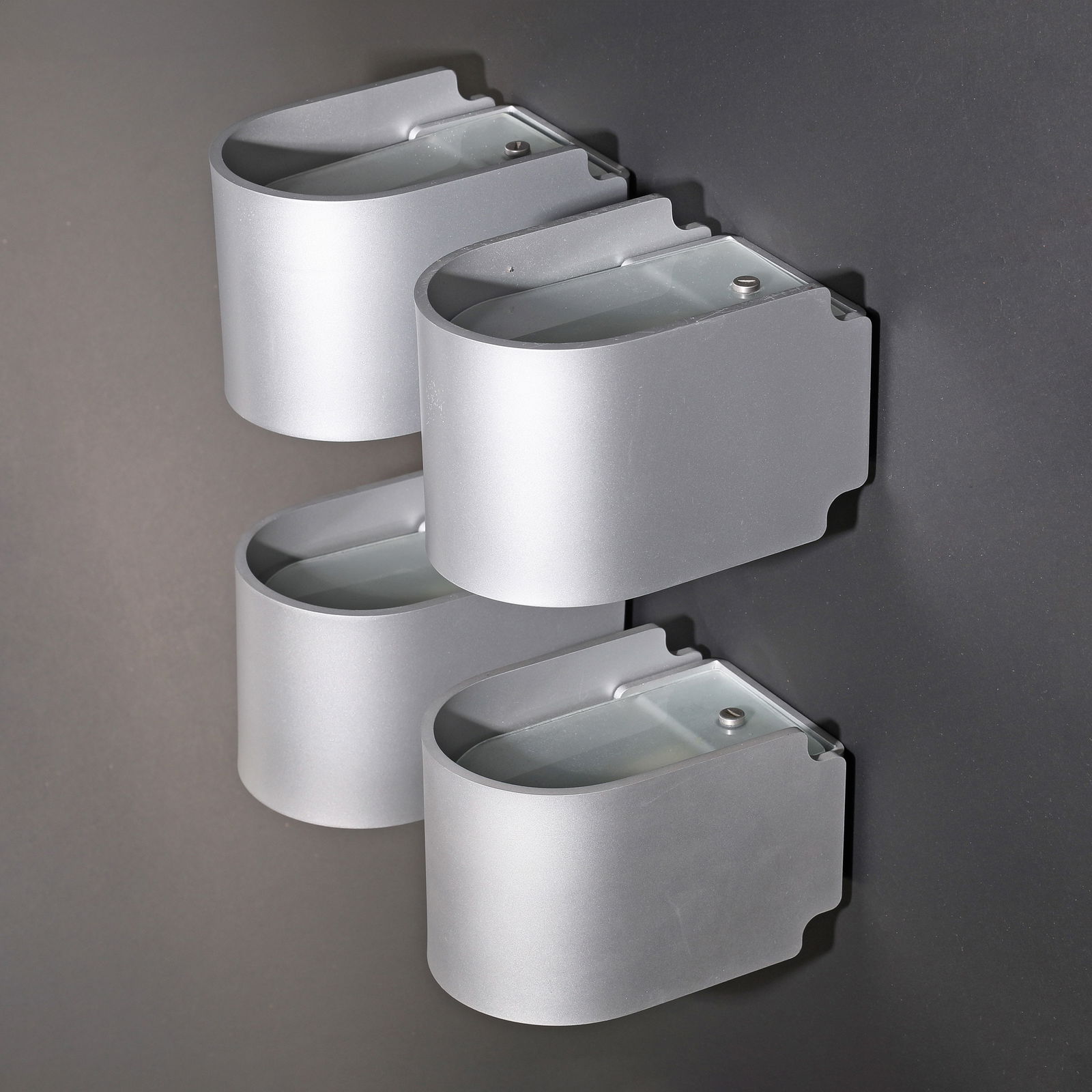 Tobias Grau, 4 wall lights model Simple, from the first generation: Tobias Grau Designed in 2006. Finish: grey. Aluminium, frosted glass. 10 x 10.5 x 15.5 cm.
