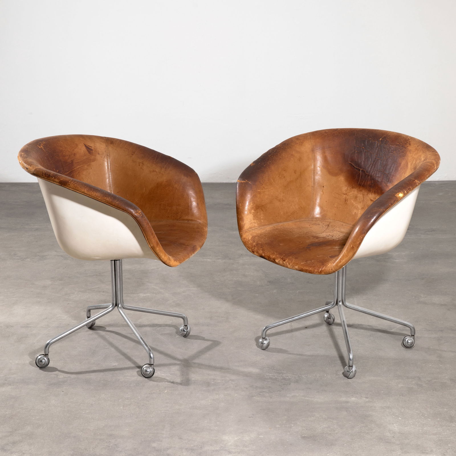 Horst Brüning, 2 shell chair prototypes: Horst Brüning Designed in 1969. Manufactured by Kill International. Chrome-plated tubular steel, white lacquered fiberglass, leather. 80 x 68 x 61 cm. Only a very small number of prototypes were