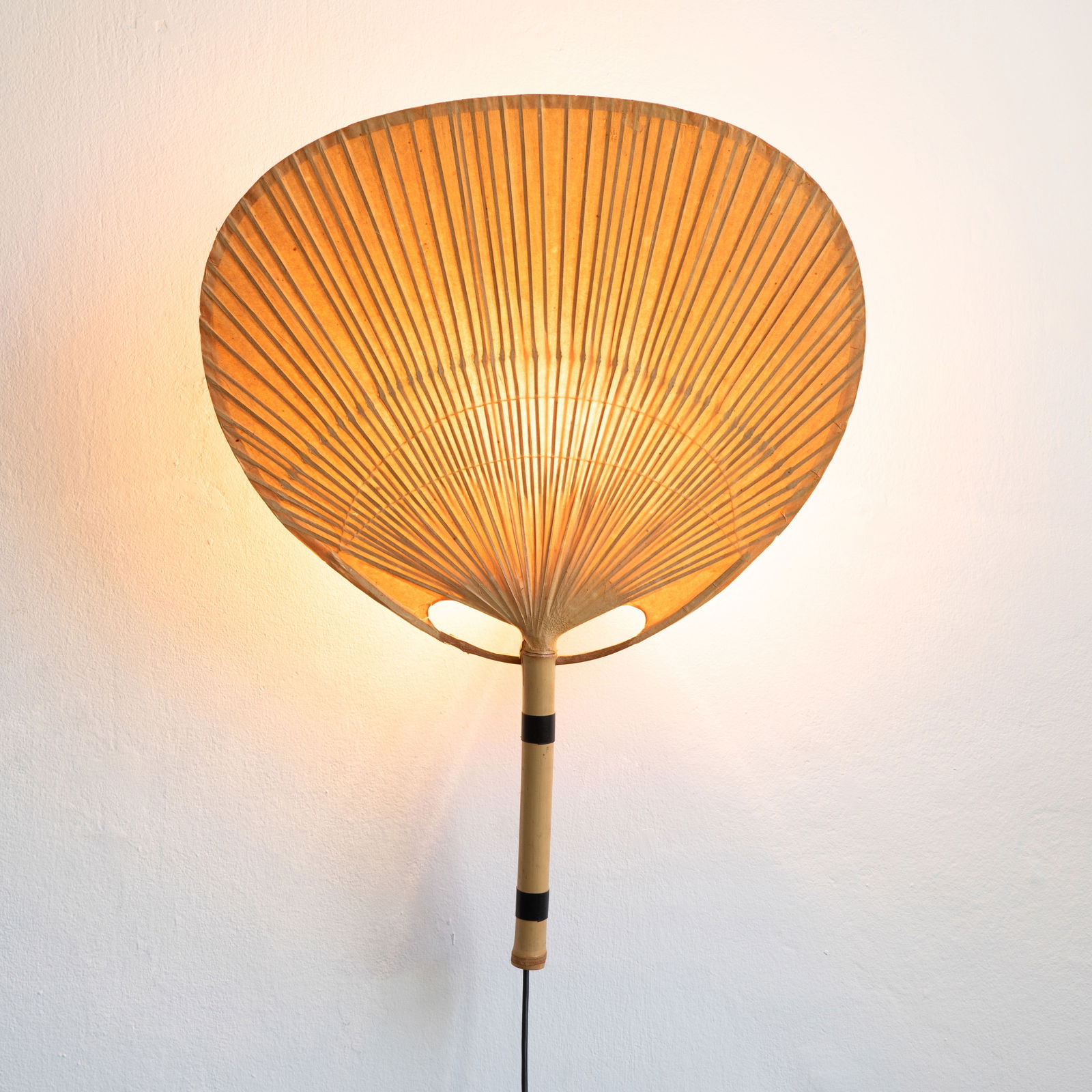 Ingo Maurer, Wall lamp model Uchiwa: Ingo Maurer Designed in the 1970s. Made by Design M. Bambus, rice paper, metal. 75 x 56 x 16 cm.