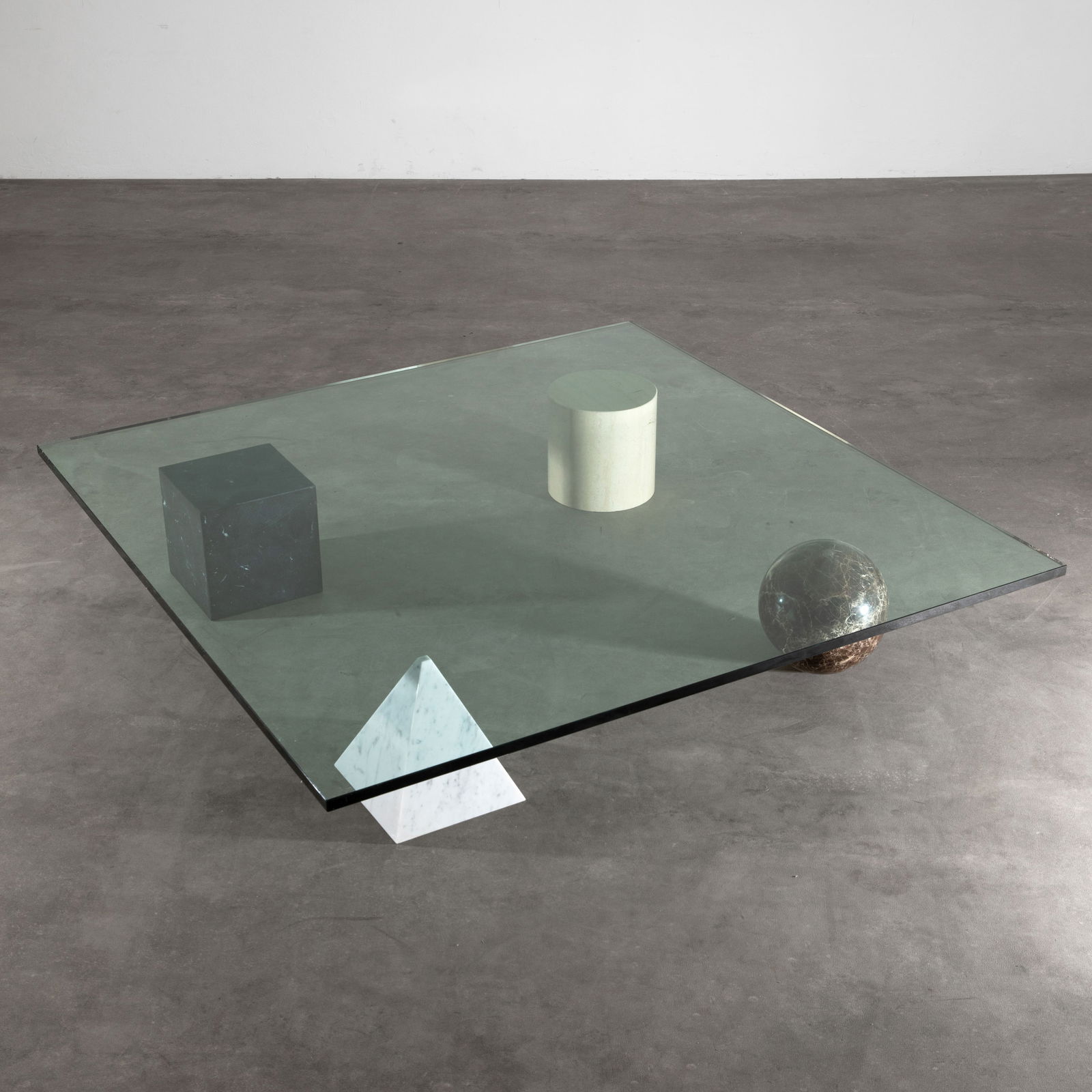 Lella & Massimo Vignelli, Coffee table model Metafora: Vignelli Designed in 1979. Manufactured by Casigliani. Geometric shapes in various marble types, glass top. 22 x 120 x 120 cm.