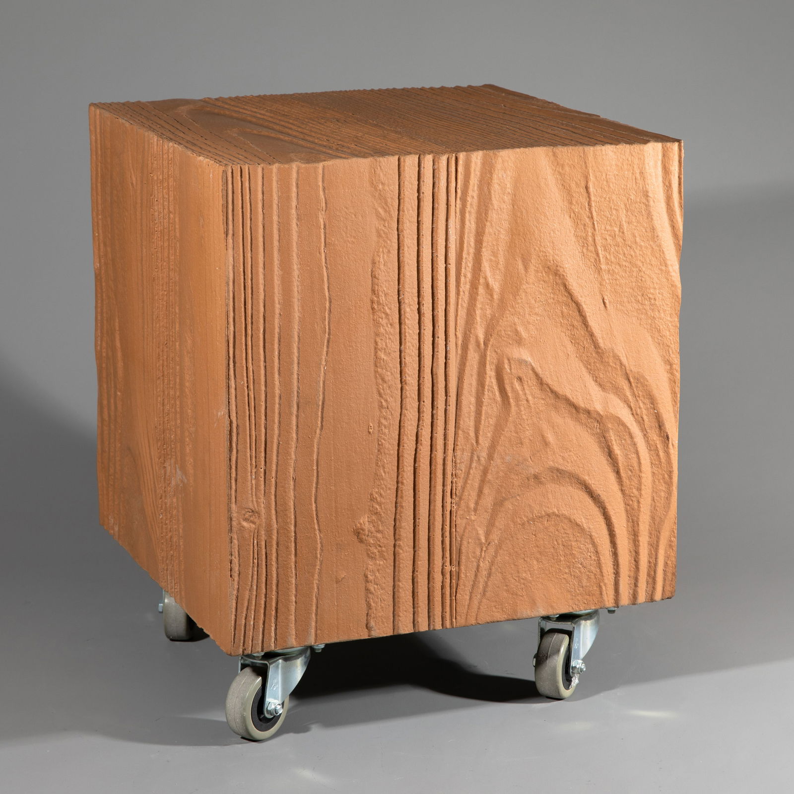 Volker Albus, Signed stool on castors model Holzblock from the Römerberg seating group: Volker Albus Designed in 1986/87. Rubber, metal plate with casters. 40.5 x 33 x 33 cm. Handwritten inscription and signature on the underside. Tobias Hoffmann & Markus Zehentbauer: Schrill Bizarr Brac