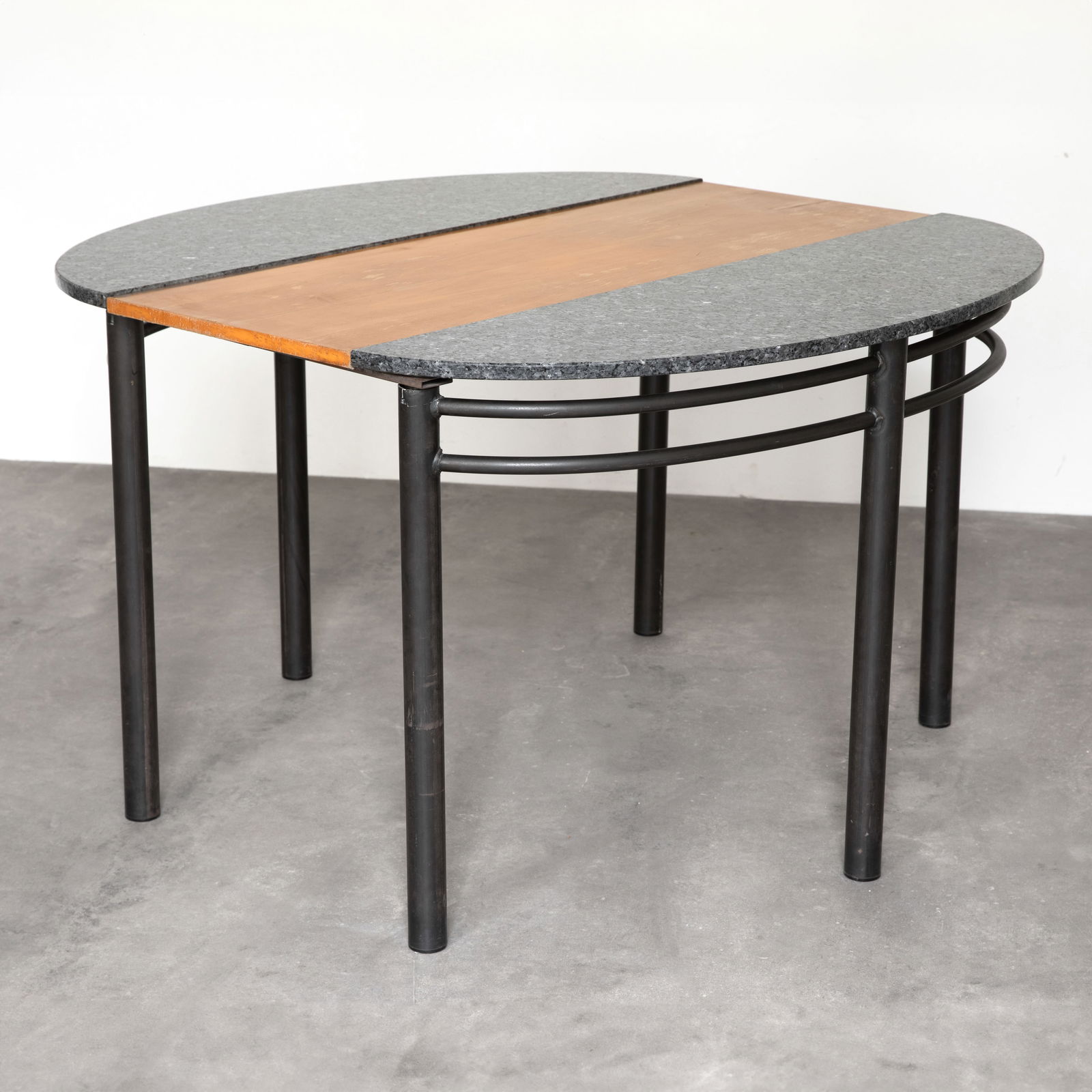 Wolfgang Laubersheimer / Pentagon, Two-piece table / console table with insert leaf: Wolfgang Laubersheimer Designed and manufactured around 1990. Tubular steel, granite, and wood. Table dimensions: 76 x 120 x 40 cm. Insert leaf: 120 x 46 cm.