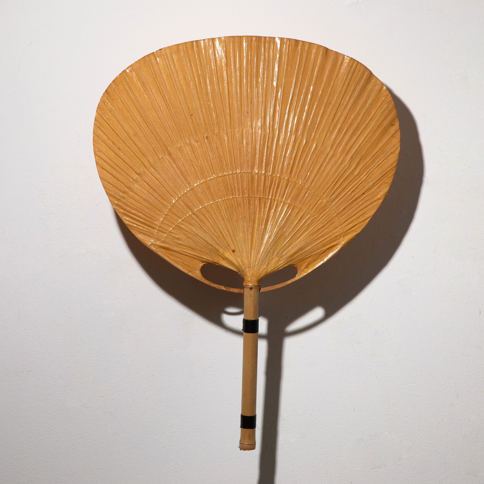 Ingo Maurer, Wall lamp model Uchiwa: Ingo Maurer Designed in the 1970s. Manufactured by Design M. Bamboo, rice paper, and metal. 77 x 57 x 17 cm.