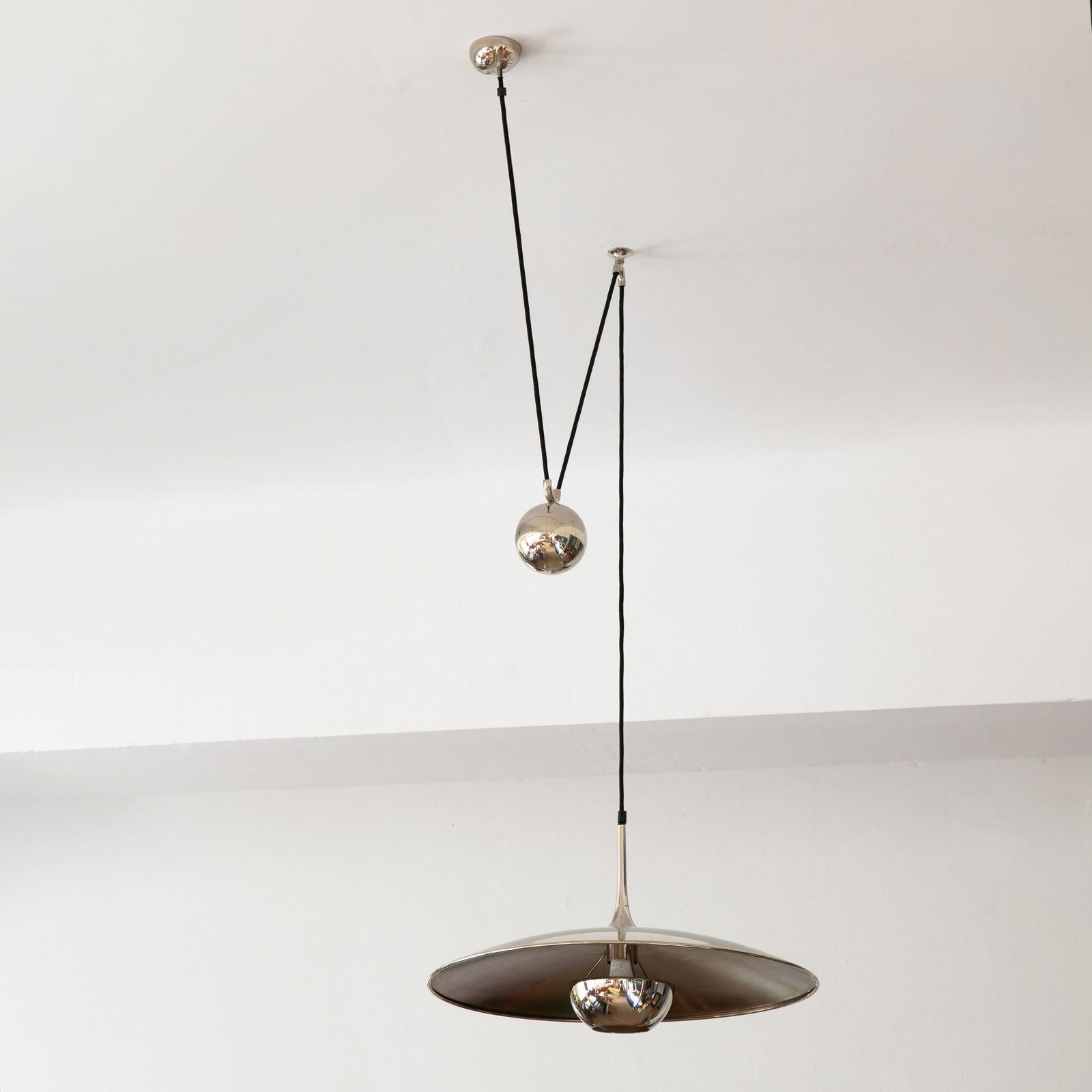 Florian Schulz, Pendant light model Onos 55: Florian Schulz Designed in the 1960/70s. Manufactured by Florian Schulz GmbH. Chrome-plated metal, black fabric cable. Reflector dimensions: H. 30 cm, D. 55 cm.