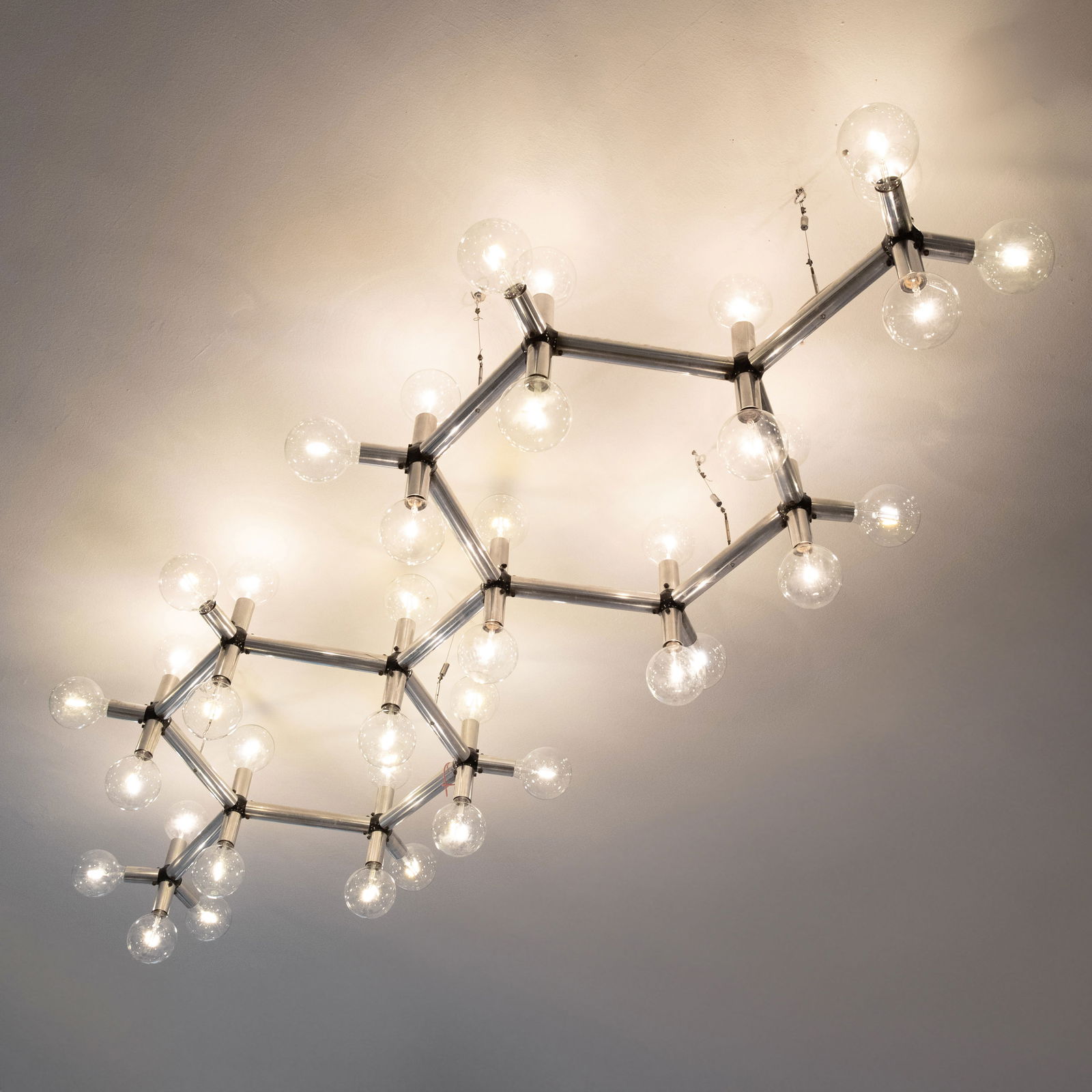 Robert Haussmann, Large ceiling light model light structure: Robert Haussmann Designed in the 1960s. Made by Swiss Lamp. Aluminum, metal, and plastic. Bulb included. Dimensions without bulb: 275 x 85 x 23 cm.