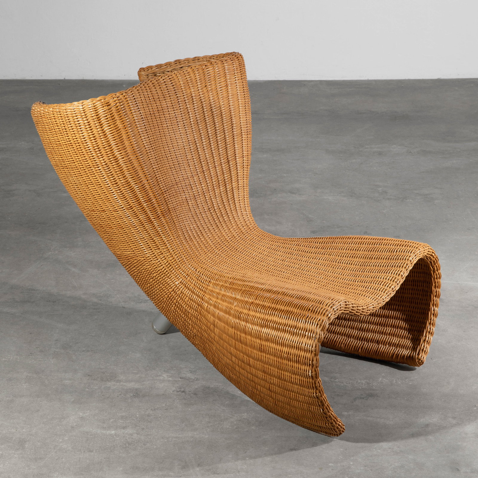 Marc Newson, Lounge chair model Wicker Chair: Marc Newson Designed in 1990. Executed by Idee. Metal frame with wickerwork covering, silver-lacquered tubular steel legs. 74 x 67 x 95 cm.