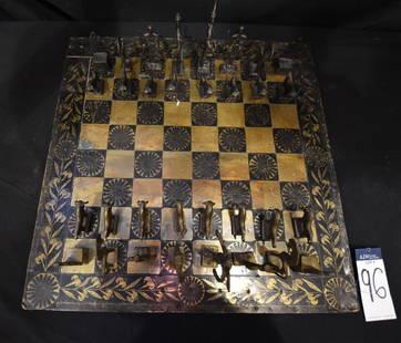 Cast Bronze Chess Set w/ Hand-Painted Brass Chess Board: Minoan themed Cast Bronze Modernist Chess set, by Greek artist Selavenit. Queens are marked Skave. Other pieces are marked with Selavenit design. Chess board is hand-painted brass plate over wood. Boa