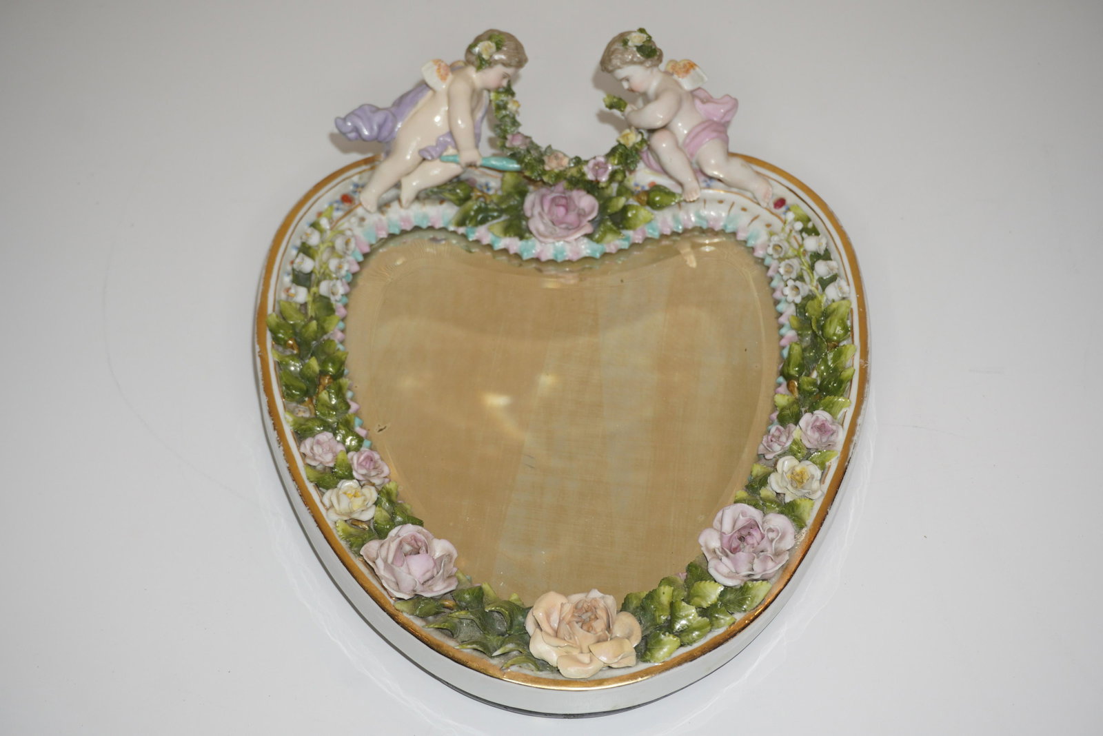 MEISSEN ANTIQUE GERMAN BISQUE MIRROR: MEISSEN ANTIQUE GERMAN BISQUE CHERUB DEOCORATED MIRROR, 11"H X 9"W, VERY GOOD CONDITION