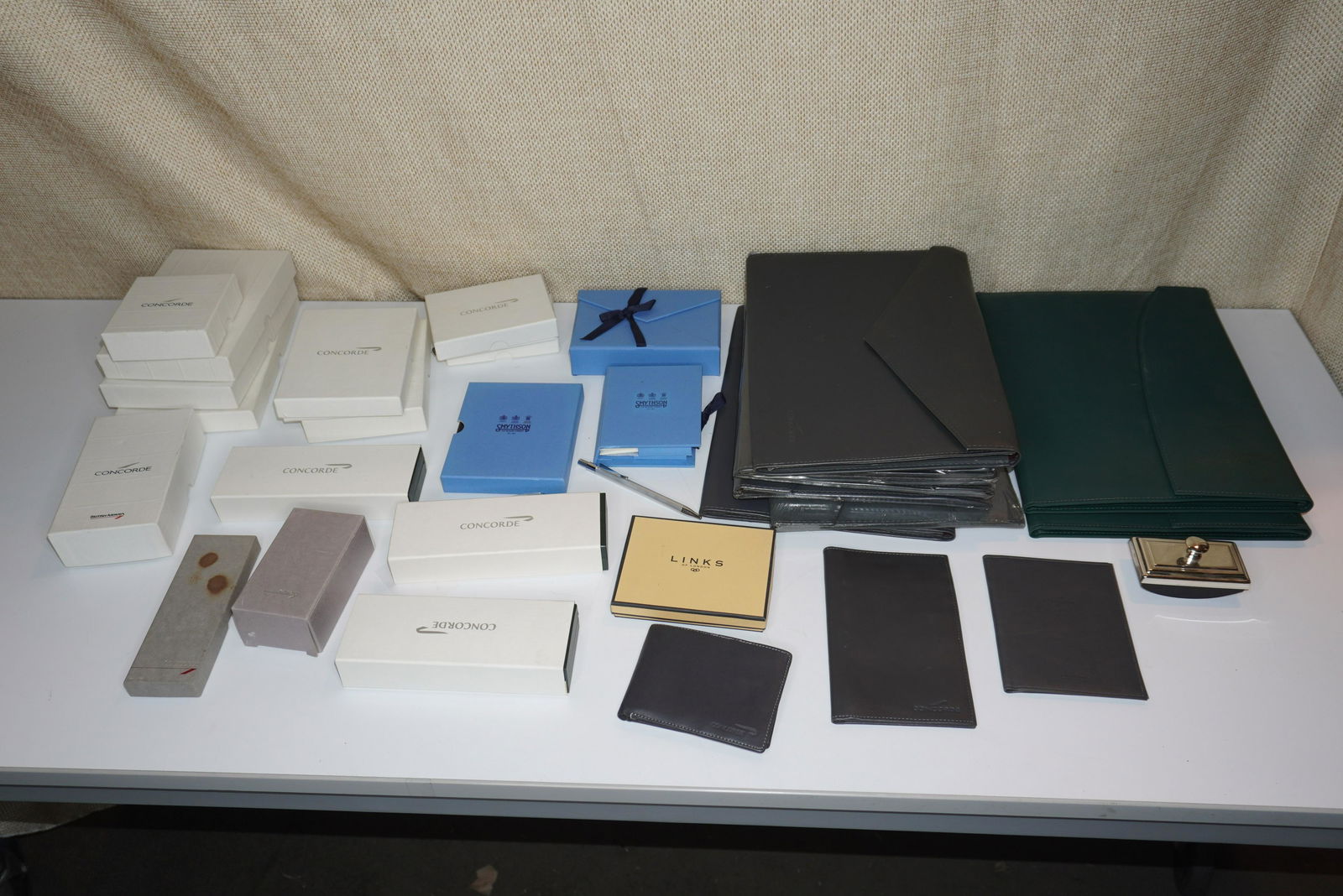 A LARGE COLLECTION OF CONCORDE ITEMS: BRITISH AIRWAYS CONCORDE FRAMES, COASTERS, PEN SETS, NAPKIN RINGS, TRINKET BOXES, NOTEBOOKS & BINDERS, VERY GOOD CONDITION