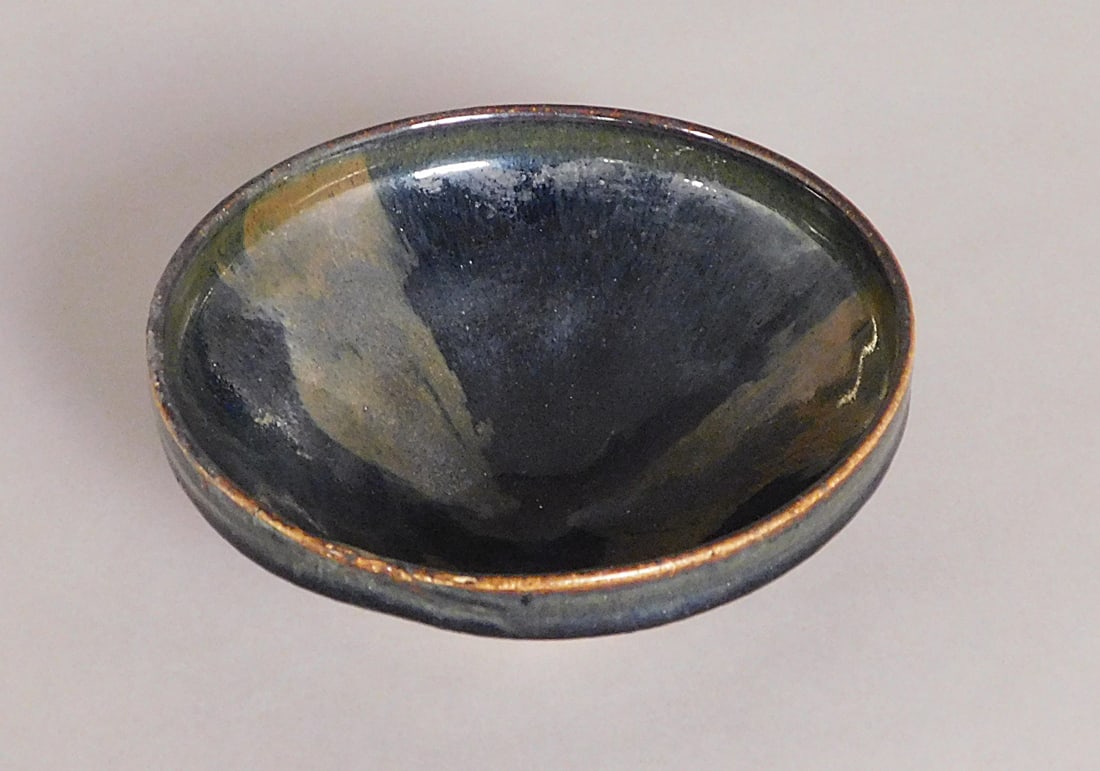 Oil Spot Stoneware Bowl Jin Dynasty: Oil Spot Stoneware Bowl presumably Jin Dynasty (1115-1234) possible inscription on base approx. 2.75 x 7" Diam. PROVENANCE: Weisbrod Chinese Art, Ltd., New York