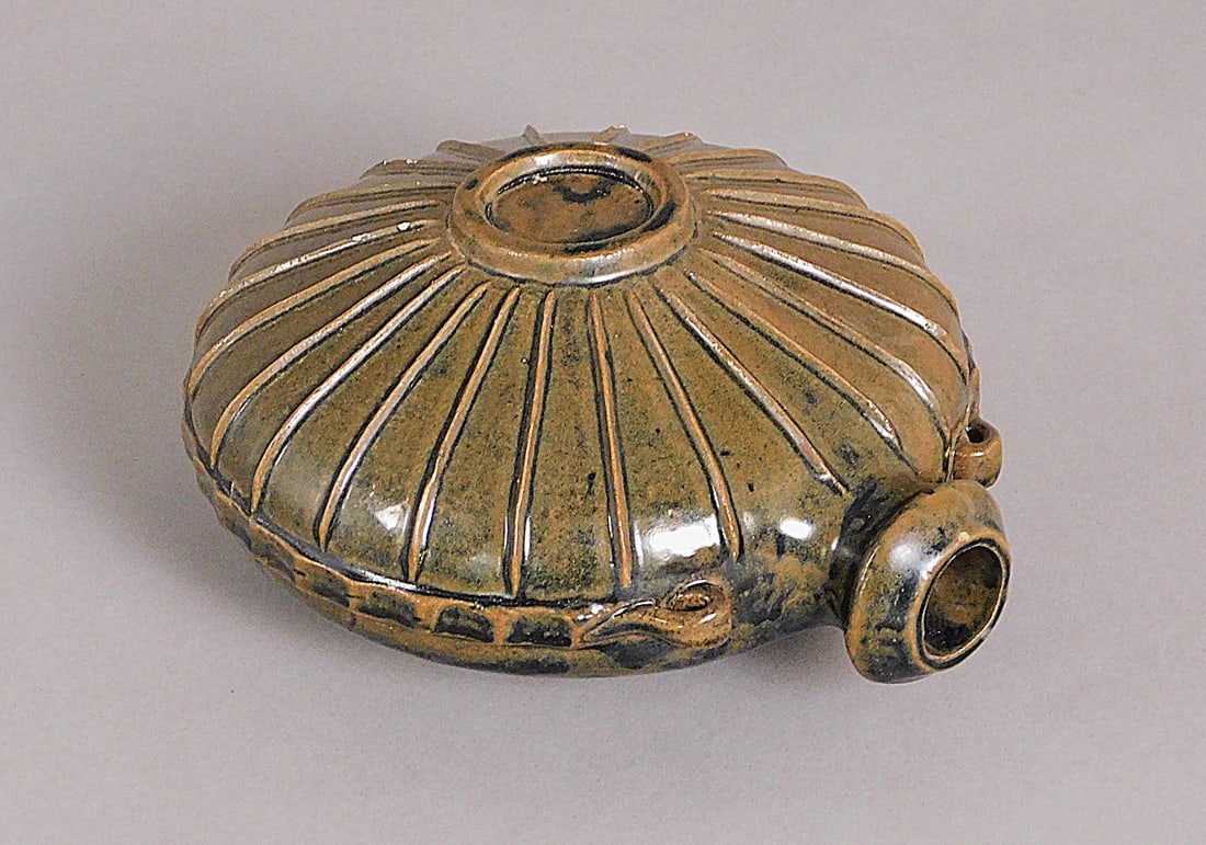 Stoneware Ribbed Wine Pot Garnet Glaze Yuan/Ming Dynasty: Stoneware Ribbed Wine Pot Garnet Glaze presumably Yuan/Ming Dynasty (1279-1644) Approx. 4.25 x 8" Diam. PROVENANCE: Weisbrod Chinese Art, Ltd., New York