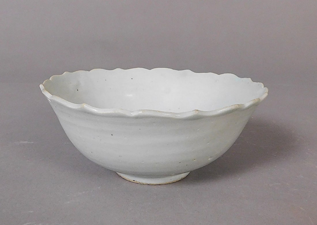 Scalloped Edge Bowl with Qingbai Glaze Song Dynasty: Scalloped Edge carved bowl with Qingbai Glaze presumably Song Dynasty (960-1279) Approx. 2.5 x 5.75" Diam. PROVENANCE: Weisbrod Chinese Art, Ltd., New York