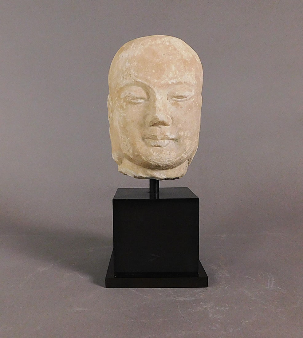 Carved Marble Lohan Head Song Dynasty: Carved Marble Lohan Head presumably Song Dynasty (960-1279) pole mounted on a plinth Approx. 6.75 x 4.25 x 5" (Overall 12") PROVENANCE: Weisbrod Chinese Art, Ltd., New York
