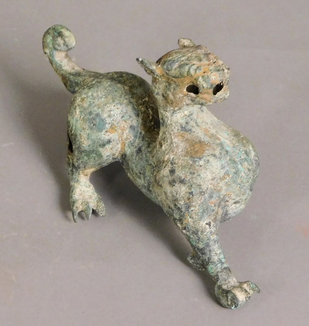 Bronze Bixie (Chimera) Figure Tang Dynasty: Bronze Bixie or Chimera presumably Tang Dynasty (618-907) Approx. 4 x 7.25 x 3.75" PROVENANCE: Weisbrod Chinese Art, Ltd., New York