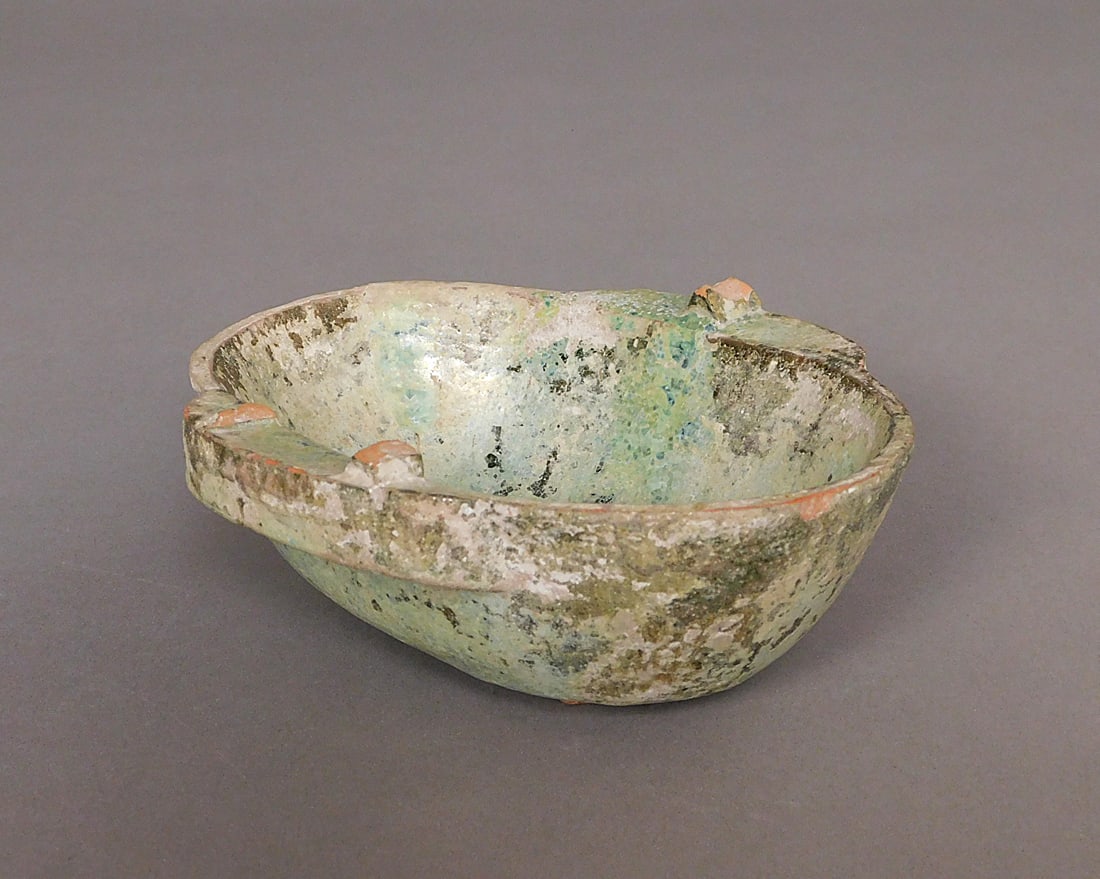 Iridescent Glazed Ear Cup Han Dynasty: Iridescent Glazed Ear Cup presumably Han Dynasty (206BCE-220CE) Approx 2 x 6 x 5" PROVENANCE: Weisbrod Chinese Art, Ltd., New York