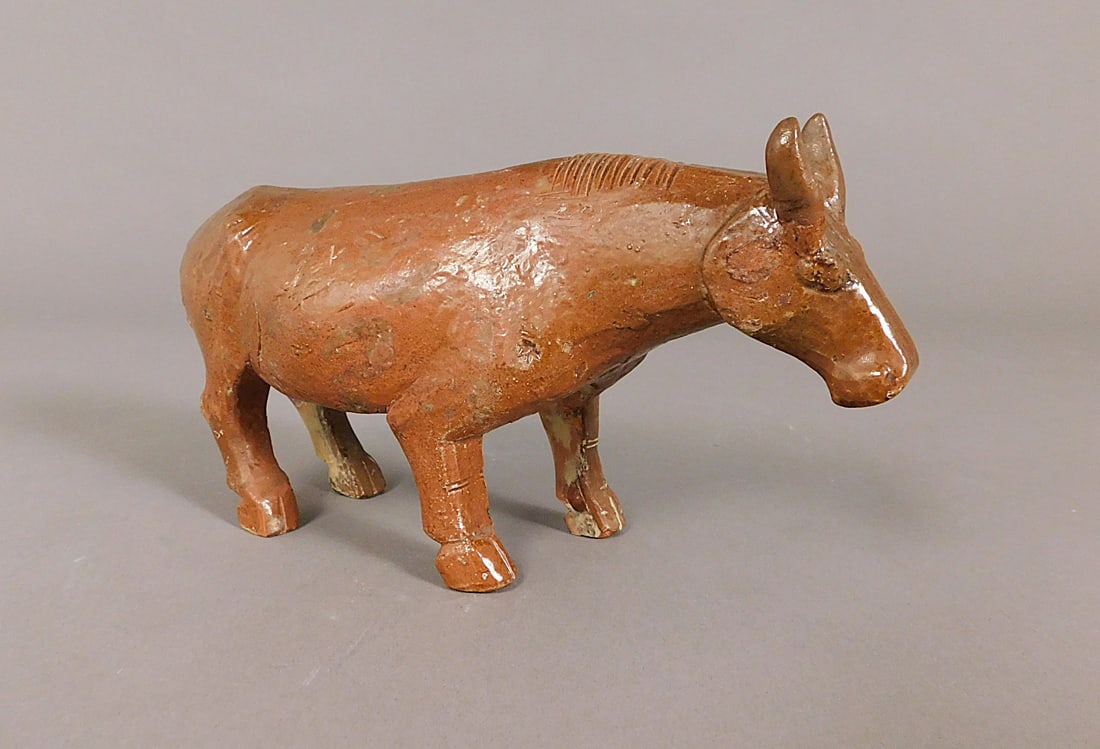 Stoneware Glazed Bull Figurine presumably Han Dynasty (206BCE-220CE): Stoneware Glazed Bull Figurine presumably Han Dynasty (206BCE-220CE) Approx. 4 x 8 x 3" PROVENANCE: Weisbrod Chinese Art, Ltd., New York