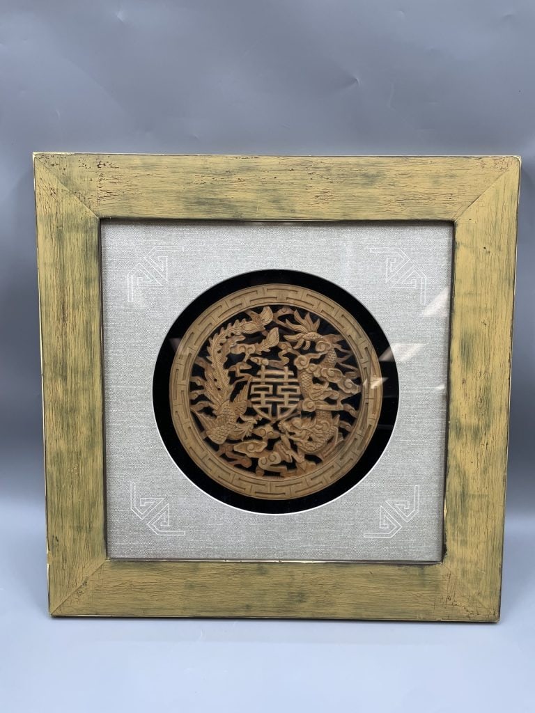 Chinese camphor wood carved: Chinese camphor wood carved rounded , with phoenix and dragon chasing fireball, framed. 61*61 cm